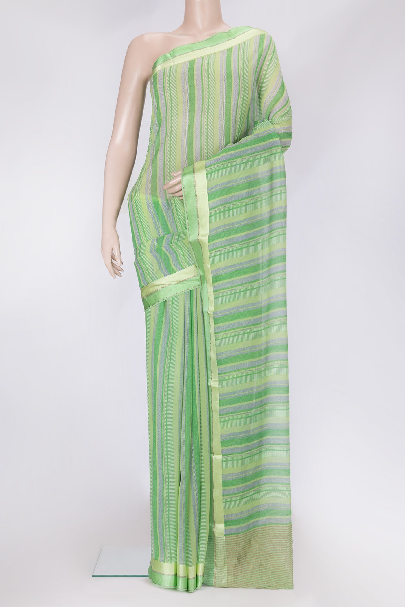 Parrot Green Dual Tone Mysore Chiffon Saree with Printed design on the body and Zari Border.  displayed on a mannequin