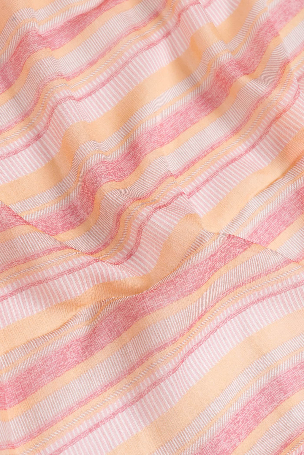 Close up of Pink Dual Tone Mysore Chiffon Saree with Printed design on the body and Zari Border.  displaying folds