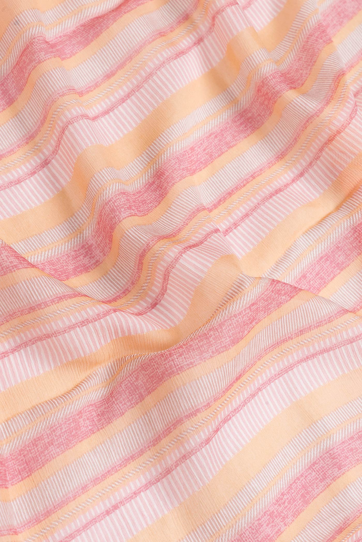 Close up of Pink Dual Tone Mysore Chiffon Saree with Printed design on the body and Zari Border.  displaying folds