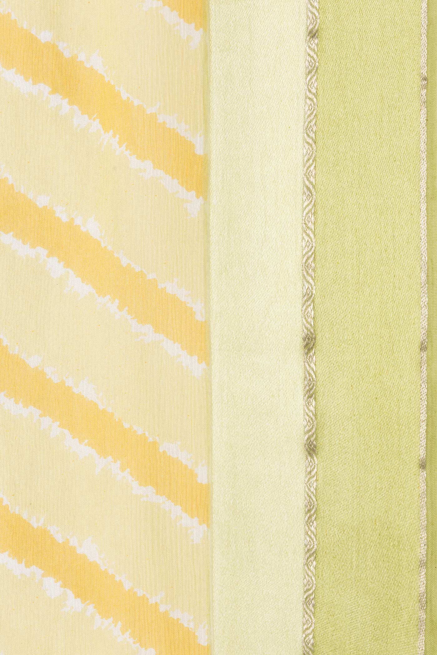 Border image of Yellow Dual Tone Chiffon Saree with Stripes on the body and Zari Border. 