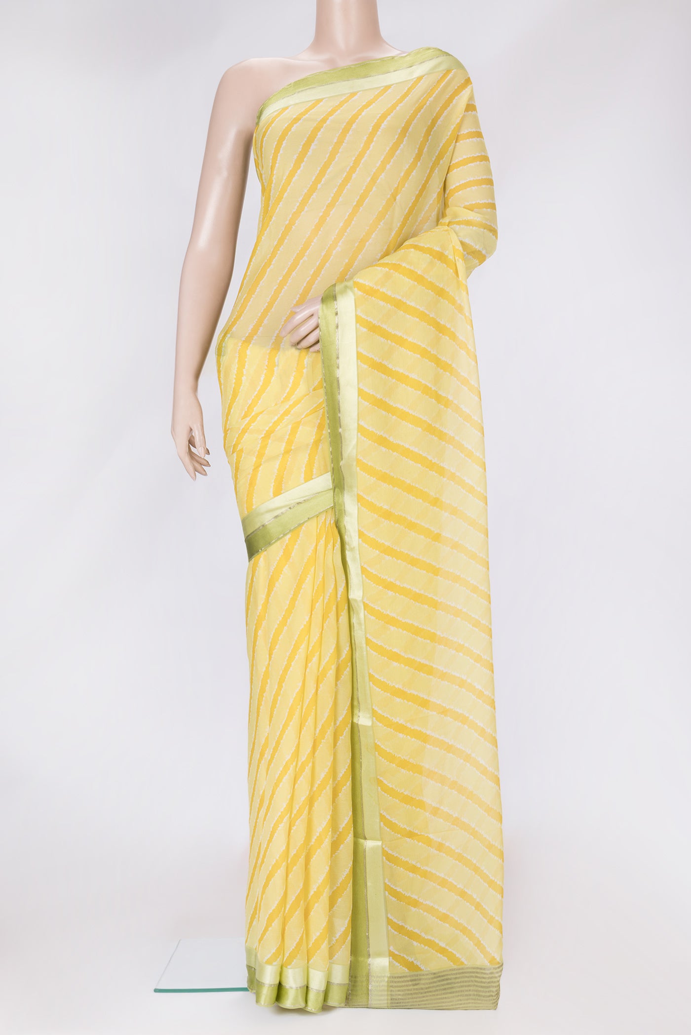 Yellow Dual Tone Chiffon Saree with Stripes on the body and Zari Border.  displayed on a mannequin