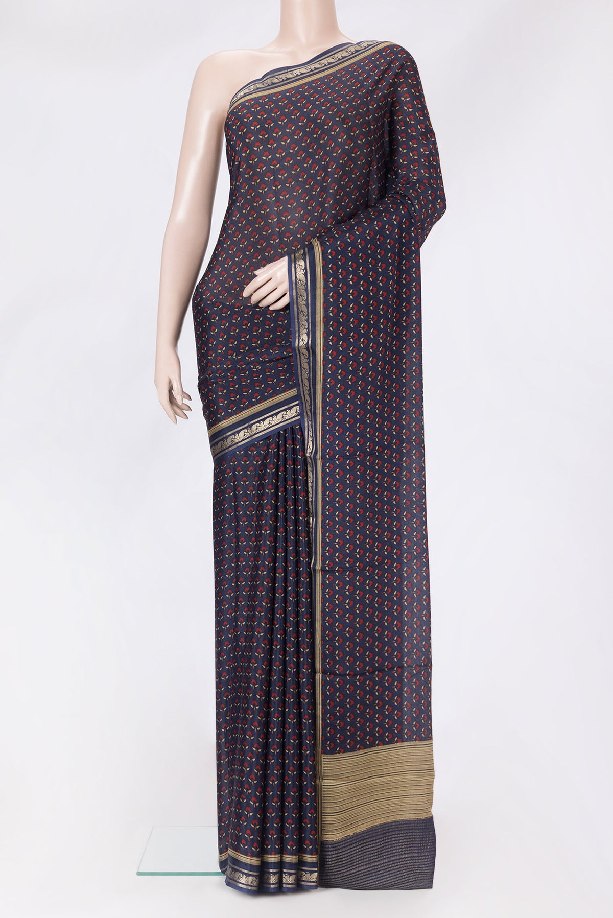 Navy Blue Crepe Saree with Printed design on the body and Zari Border.  displayed on a mannequin