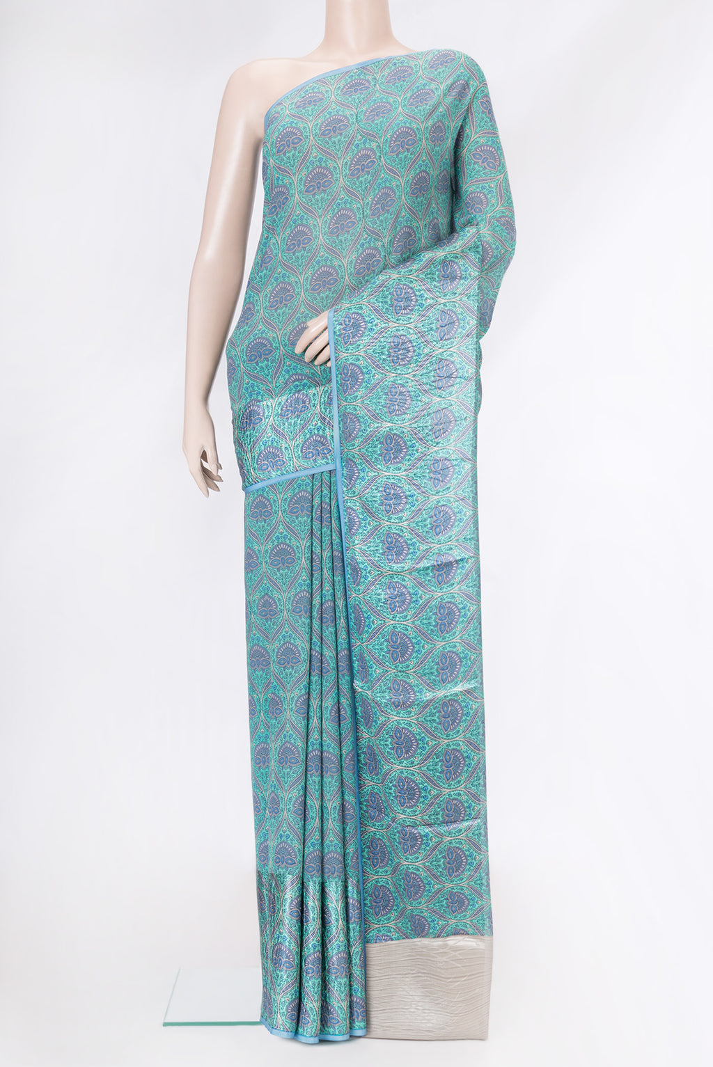Sky Blue Dual Tone Mysore Crepe Saree with Printed design on the body and Plain Border.  displayed on a mannequin