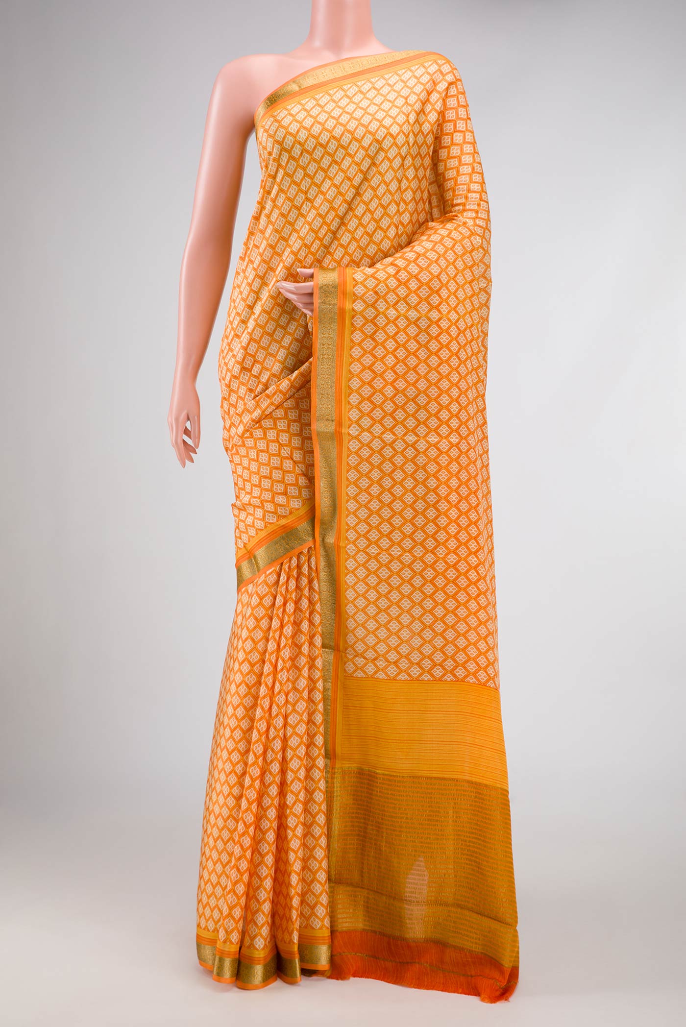 Orange Dual Tone Mysore Crepe Saree with Printed design on the body and Zari Border.  displayed on a mannequin