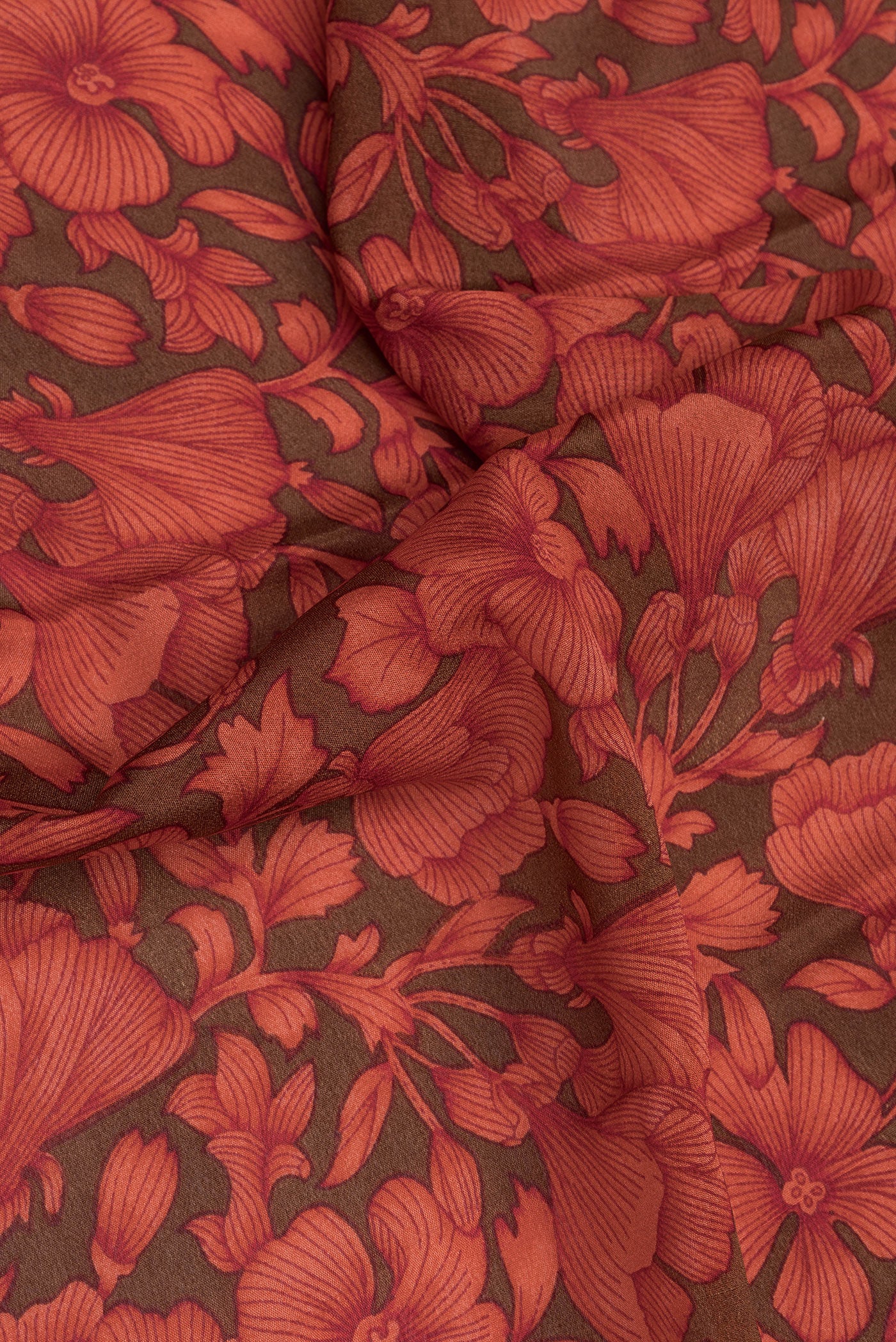 Close up of Mehandi Green Dual Tone Chiffon Saree with Printed design on the body and Zari Border.  displaying folds