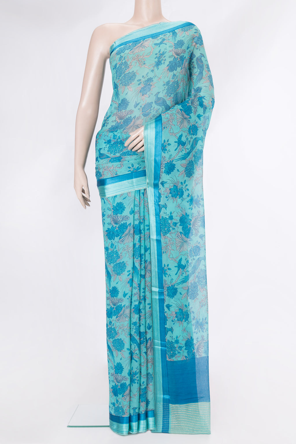 Sky Blue Mysore Chiffon Saree with Printed design on the body and Zari And Thread Border.  displayed on a mannequin