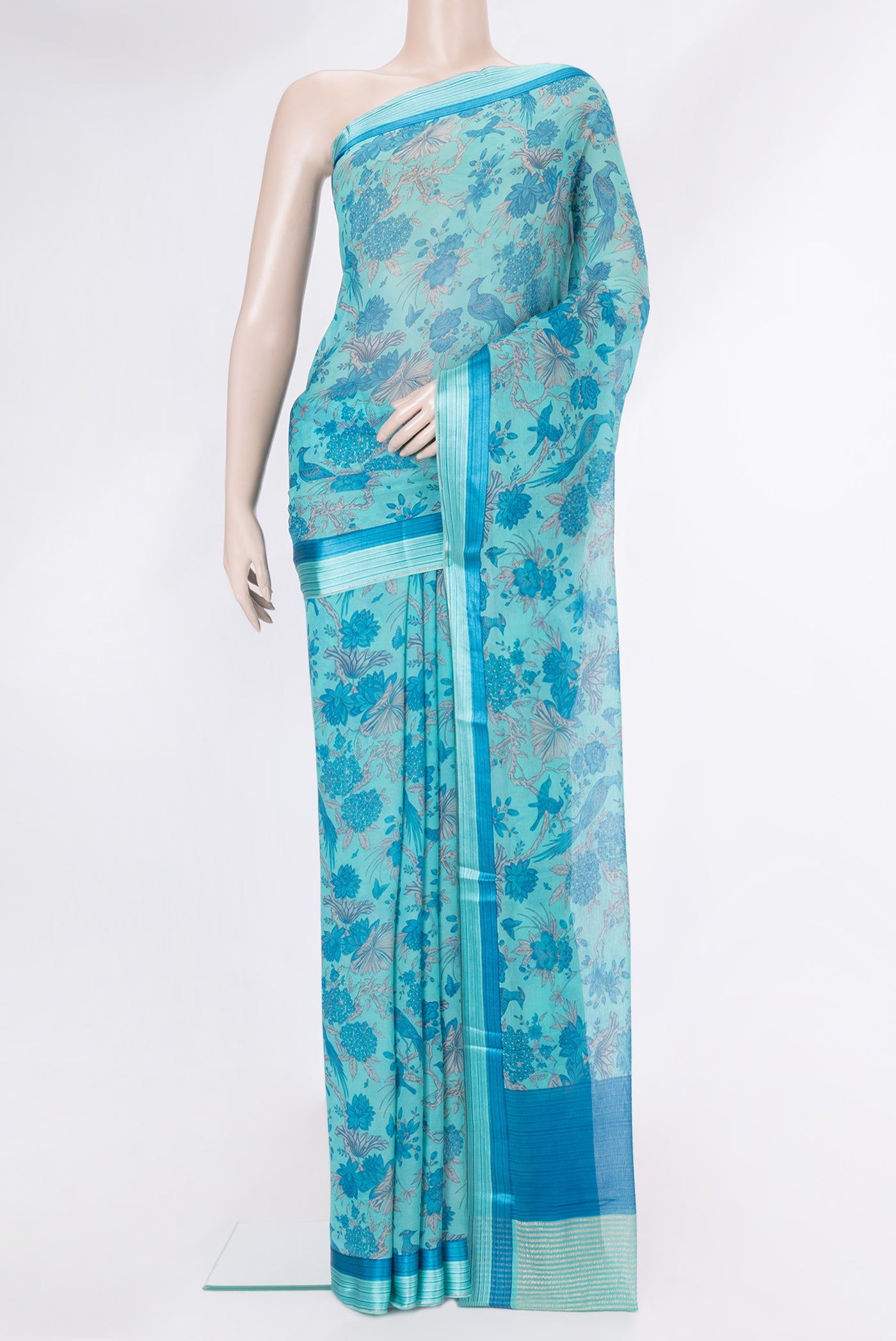 Sky Blue Mysore Chiffon Saree with Printed design on the body and Zari And Thread Border.  displayed on a mannequin