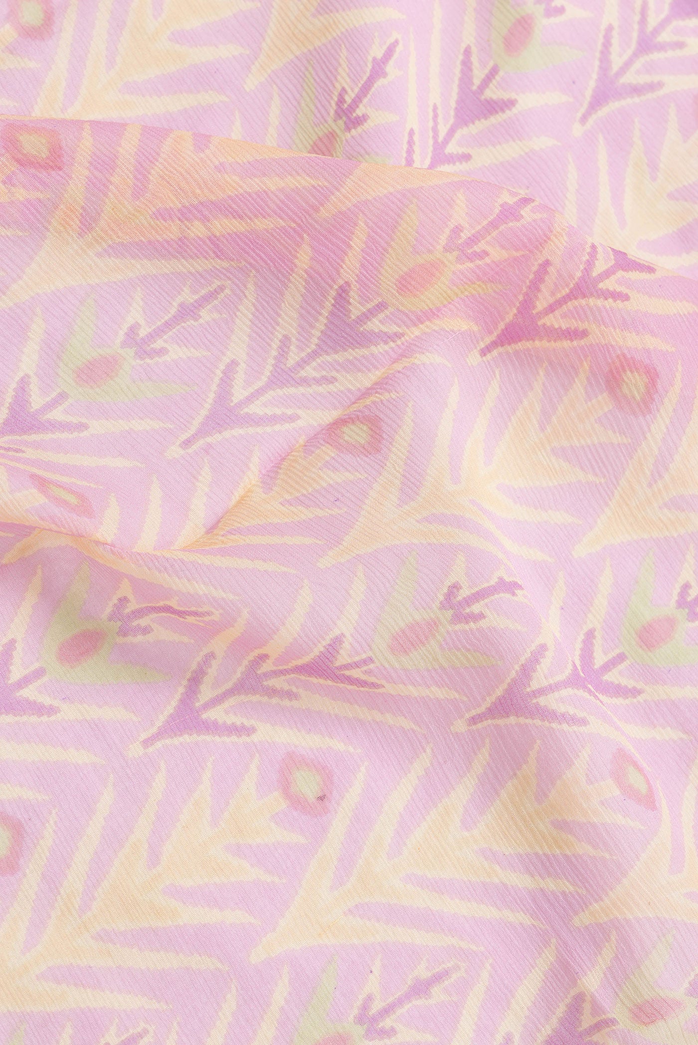 Close up of Pink Dual Tone Mysore Chiffon Saree with Printed design on the body and Zari Border.  displaying folds