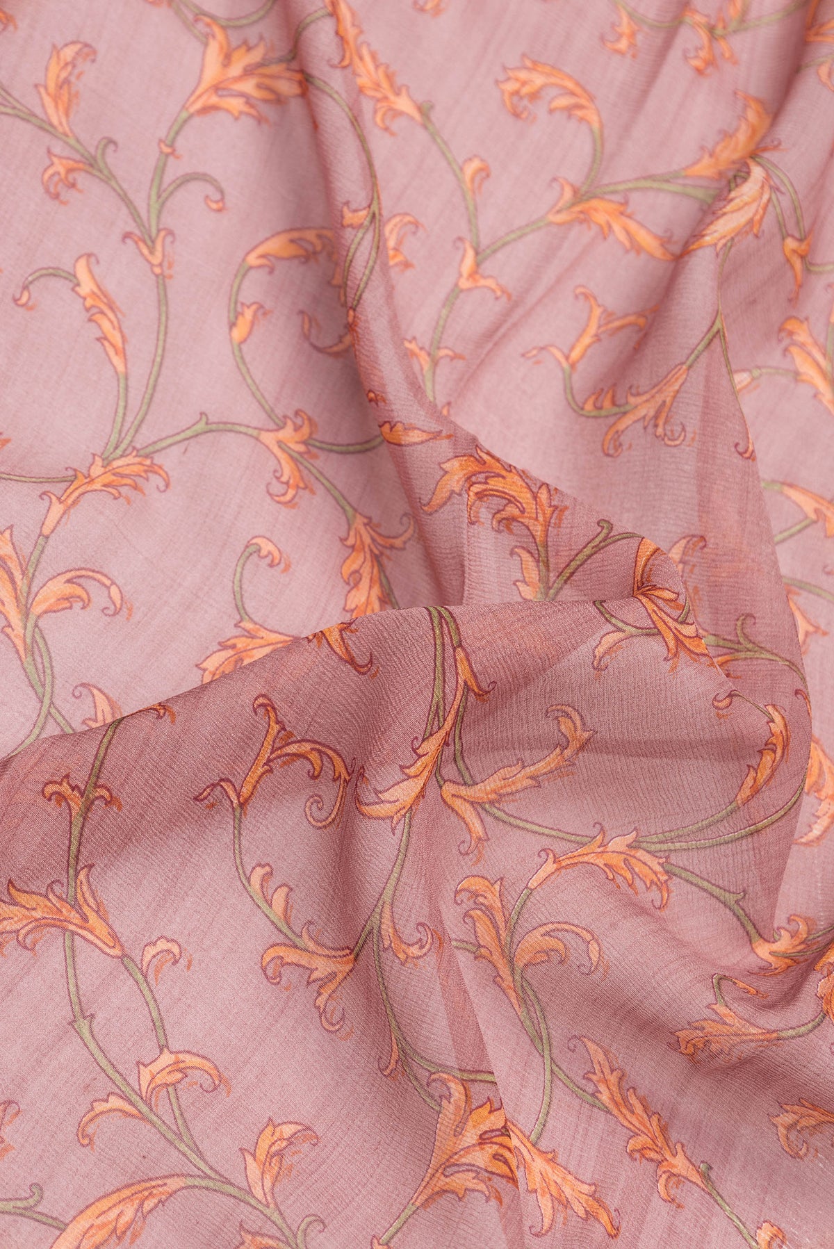Close up of Mauve Dual Tone Mysore Chiffon Saree with Printed design on the body and Thread Border.  displaying folds