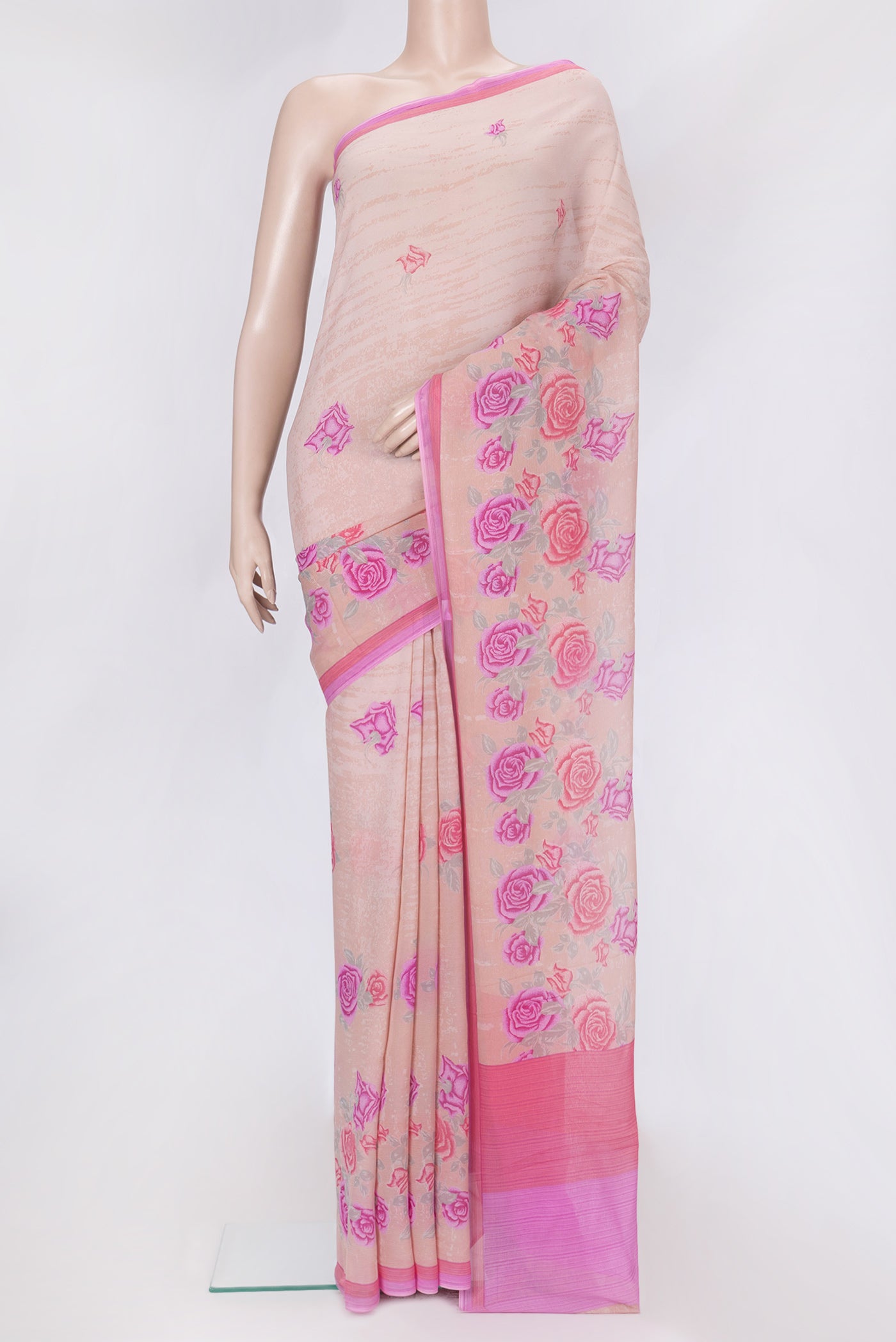 Peach Dual Tone Mysore Chiffon Saree with Printed design on the body and Plain Border.  displayed on a mannequin