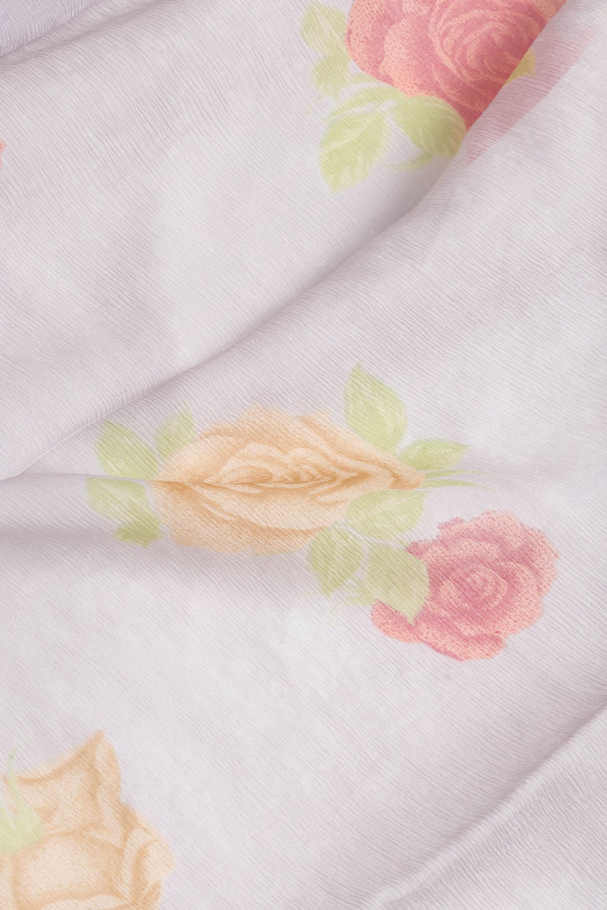 Close up of Grey Dual Tone Mysore Chiffon Saree with Printed design on the body and Printed Border.  displaying folds