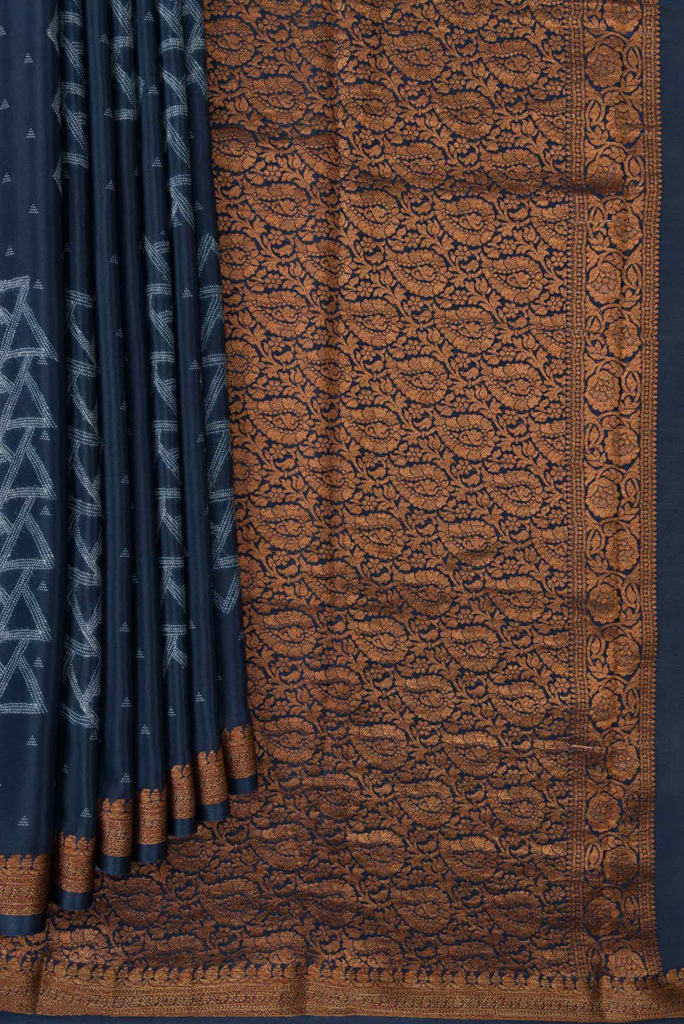 Pleats and pallu of Navy Blue Dual Tone Mysore Crepe Saree with Printed design on the body and Zari Border. 
