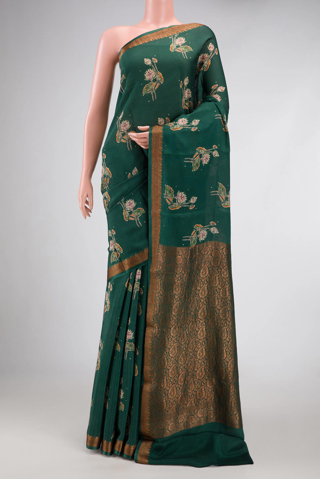 Bottle Green Dual Tone Mysore Crepe Saree with Printed design on the body and Thread Border.  displayed on a mannequin