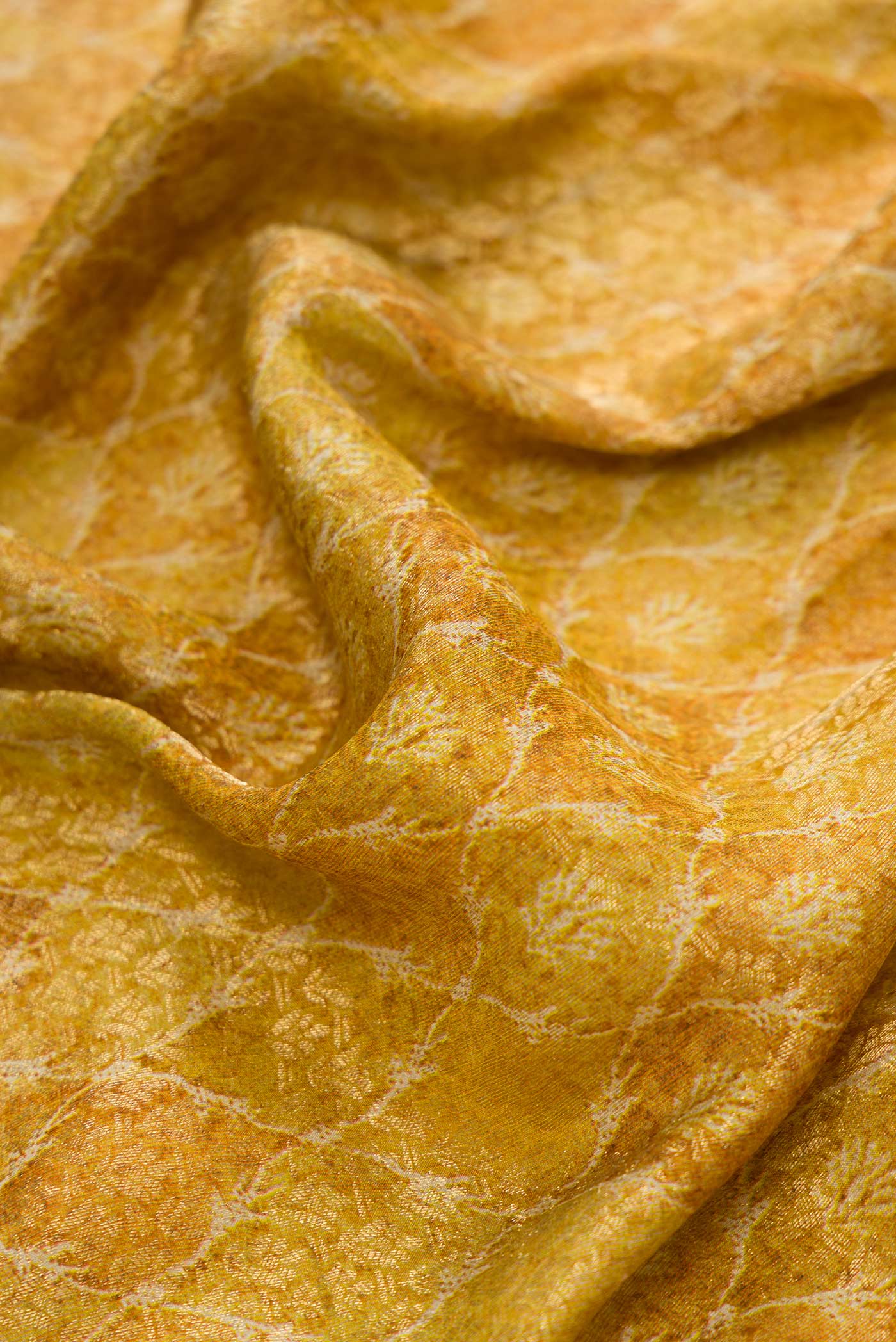 Close up of Mehandi Green Dual Tone Mysore Crepe Saree with Printed design on the body and Zari Border.  displaying folds