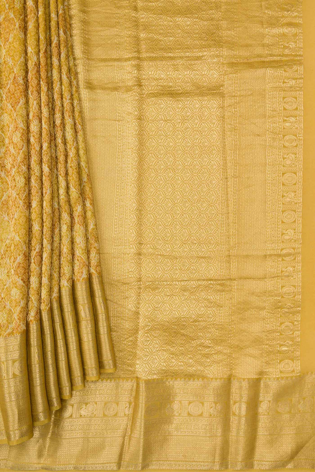 Pleats and pallu of Mehandi Green Dual Tone Mysore Crepe Saree with Printed design on the body and Zari Border. 