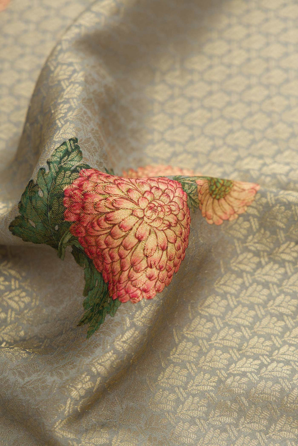 Close up of Grey Dual Tone Mysore Georgette Saree with Zari Brocade on the body and Zari Border.  displaying folds