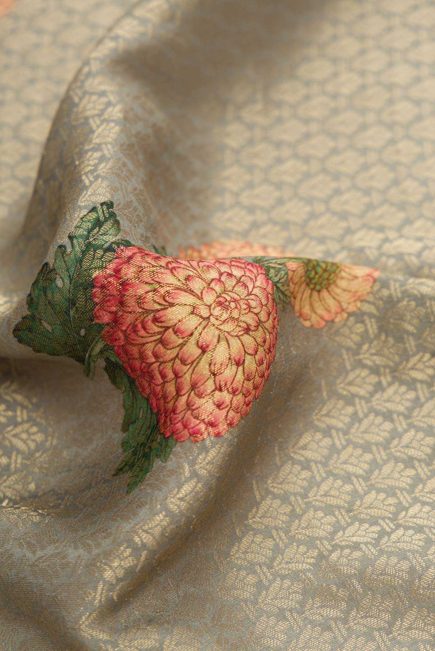 Close up of Grey Dual Tone Mysore Georgette Saree with Zari Brocade on the body and Zari Border.  displaying folds