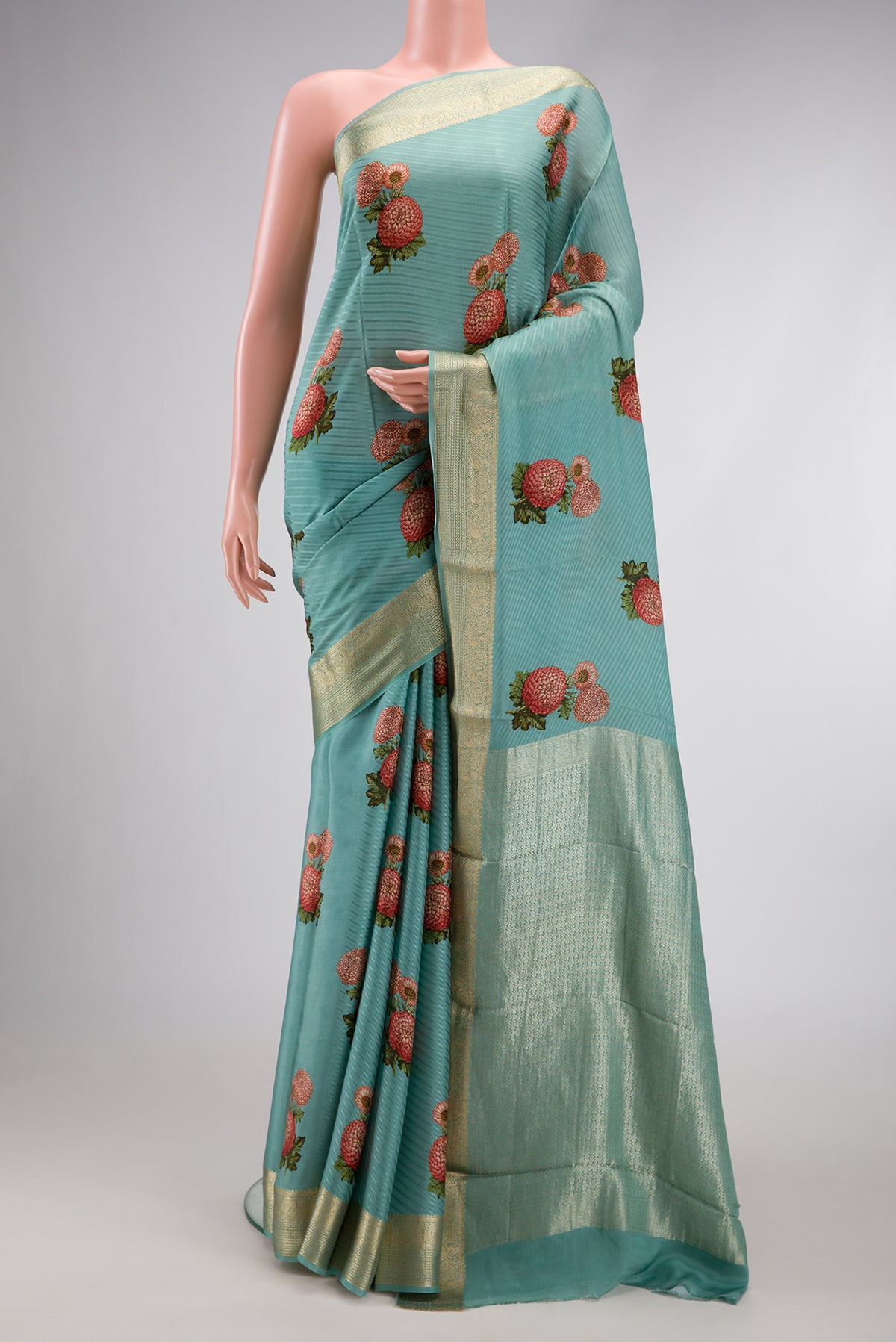 Light Blue Dual Tone Tussar Silk Saree with Printed design on the body and Zari Border.  displayed on a mannequin