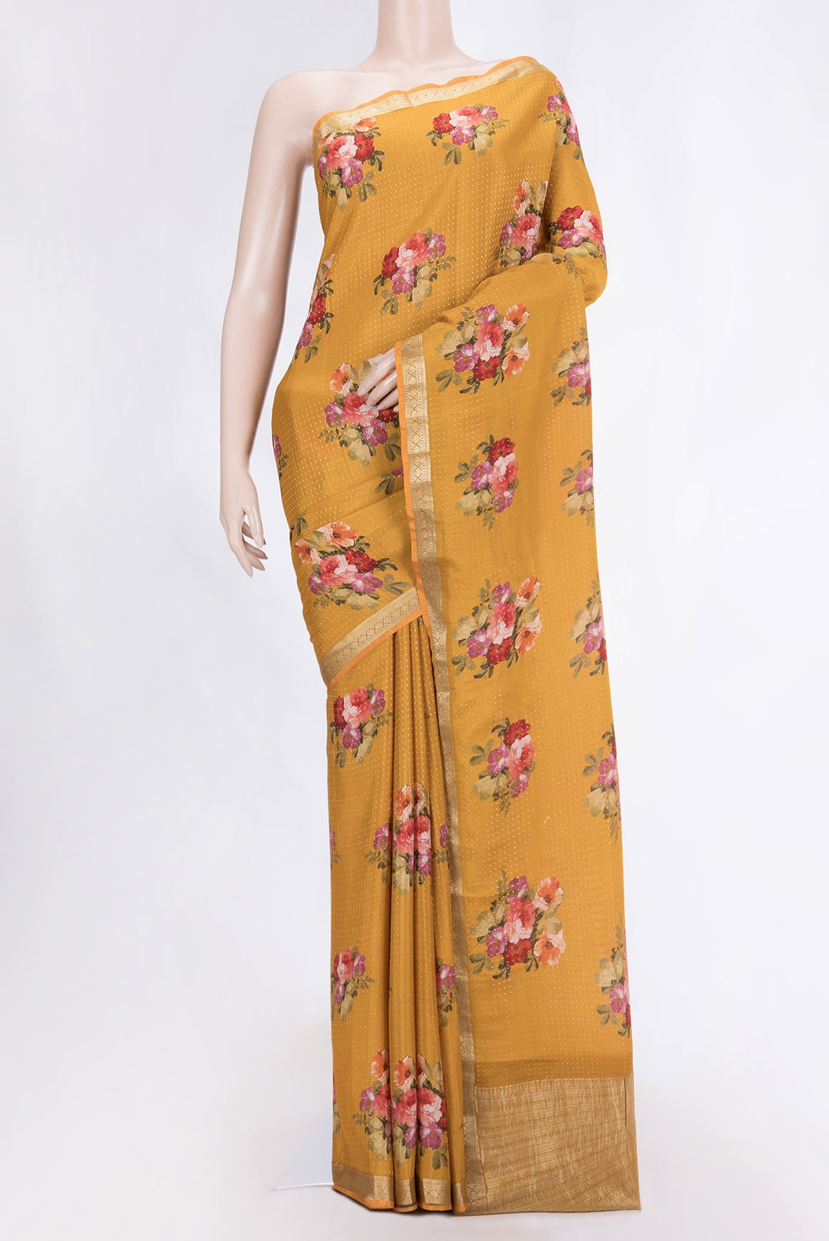 Mustard Mysore Crepe Saree with Zari Butta on the body and Zari Border displayed on a mannequin