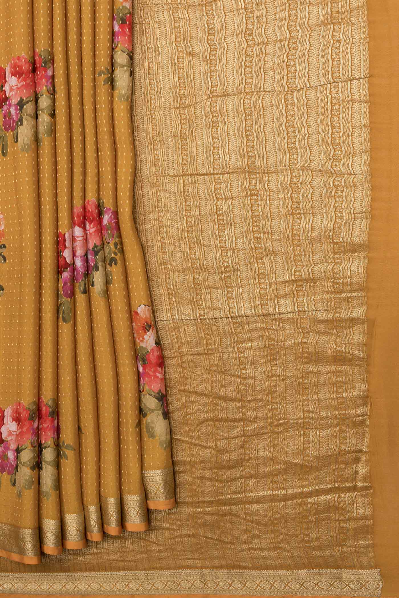 Pleats and pallu of Mustard Mysore Crepe Saree with Zari Butta on the body and Zari Border