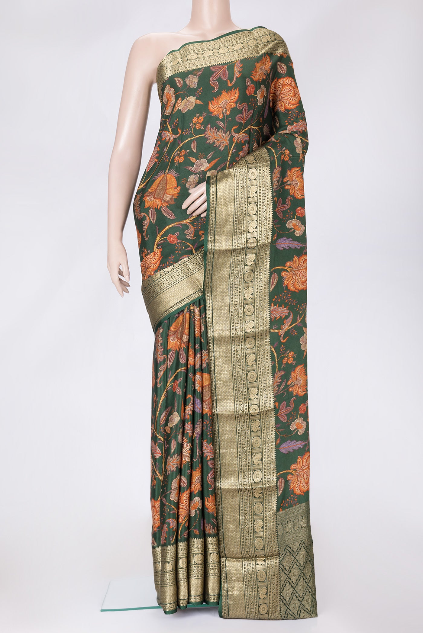 Bottle Green Dual Tone Mysore Crepe Saree with Printed design on the body and Zari Border.  displayed on a mannequin