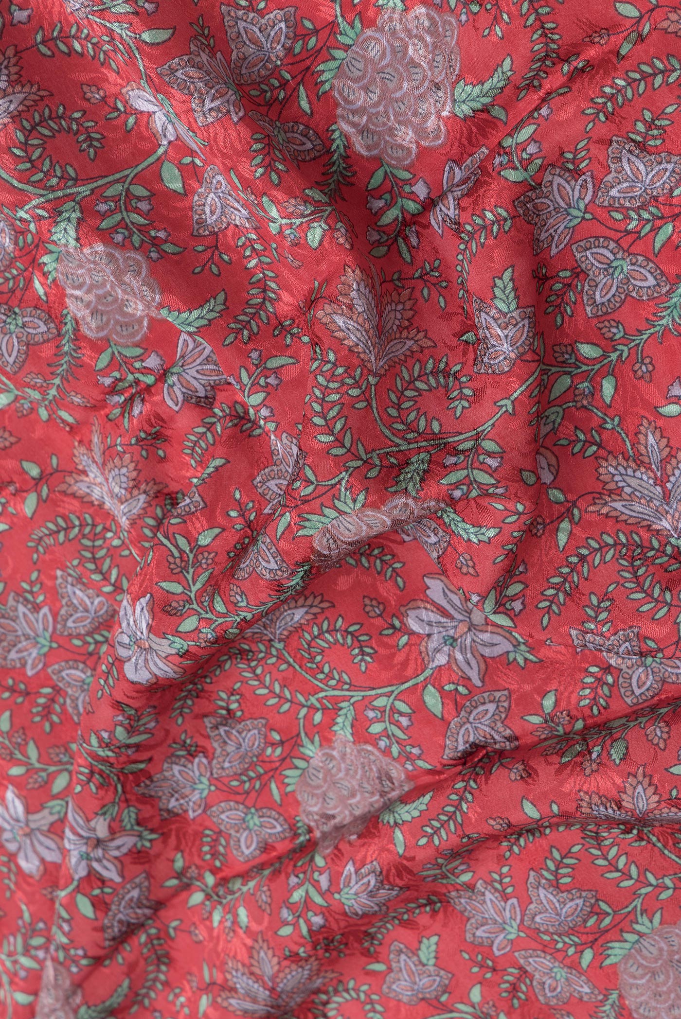 Close up of Pink Dual Tone Mysore Crepe Saree with Printed design on the body and Zari Border.  displaying folds