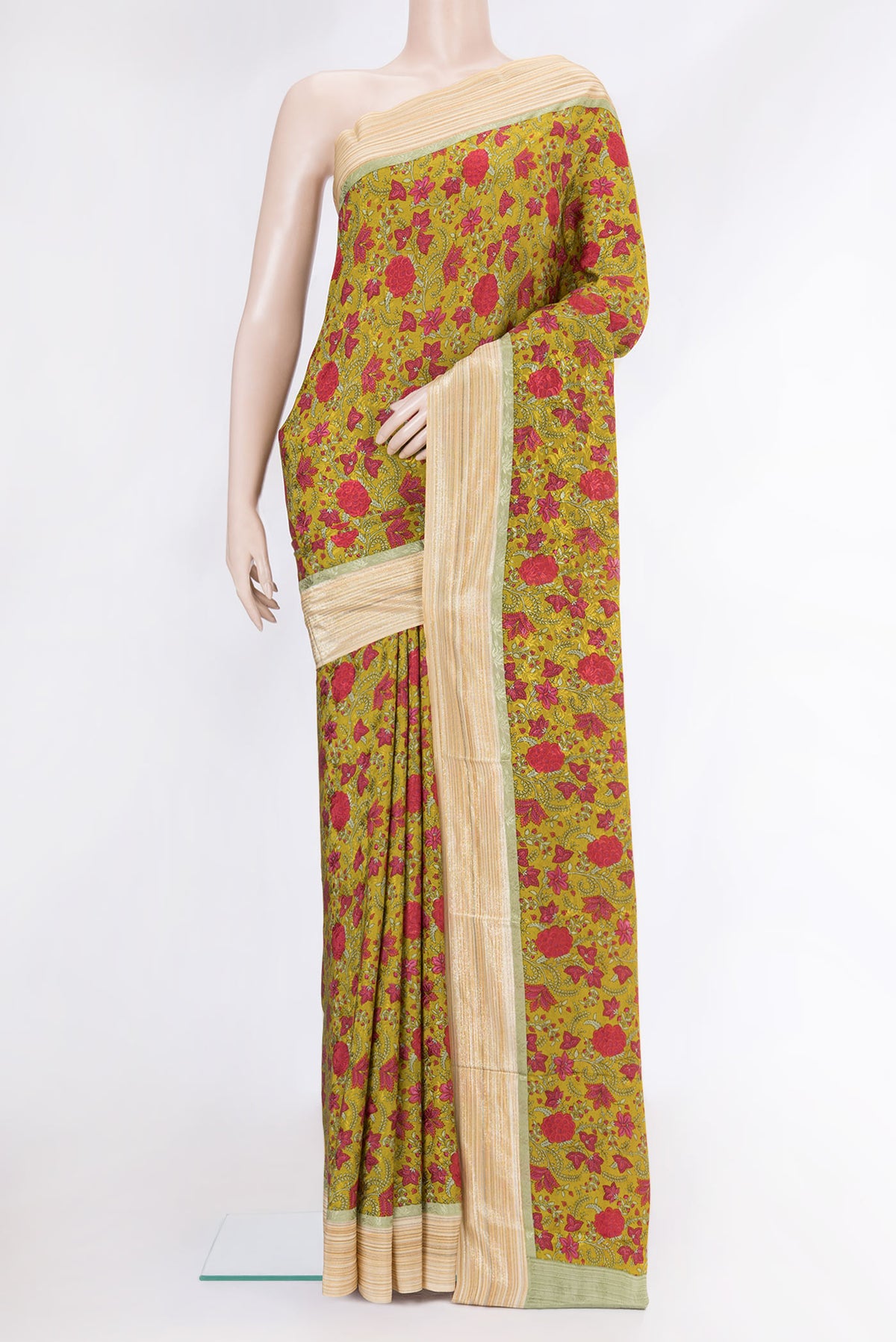 Mustard Dual Tone Mysore Crepe Saree with Printed design on the body and Zari Border.  displayed on a mannequin