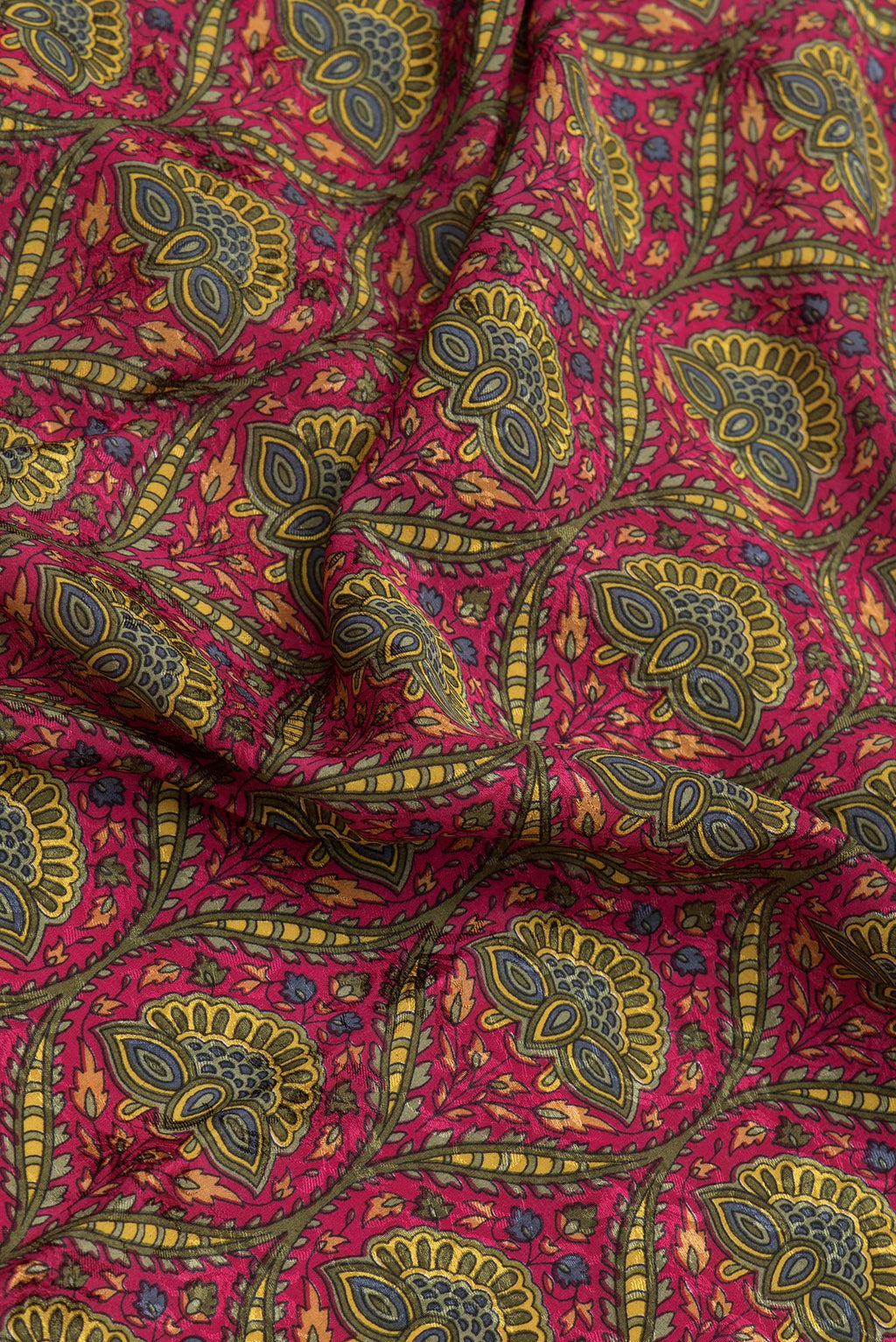 Close up of Pink Dual Tone Mysore Crepe Saree with Printed design on the body and Zari Border.  displaying folds