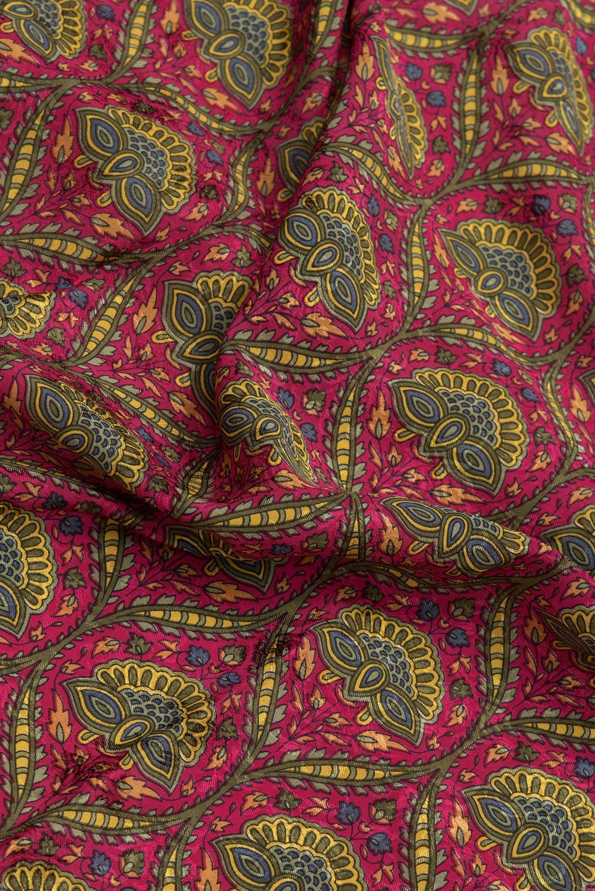 Close up of Pink Dual Tone Mysore Crepe Saree with Printed design on the body and Zari Border.  displaying folds