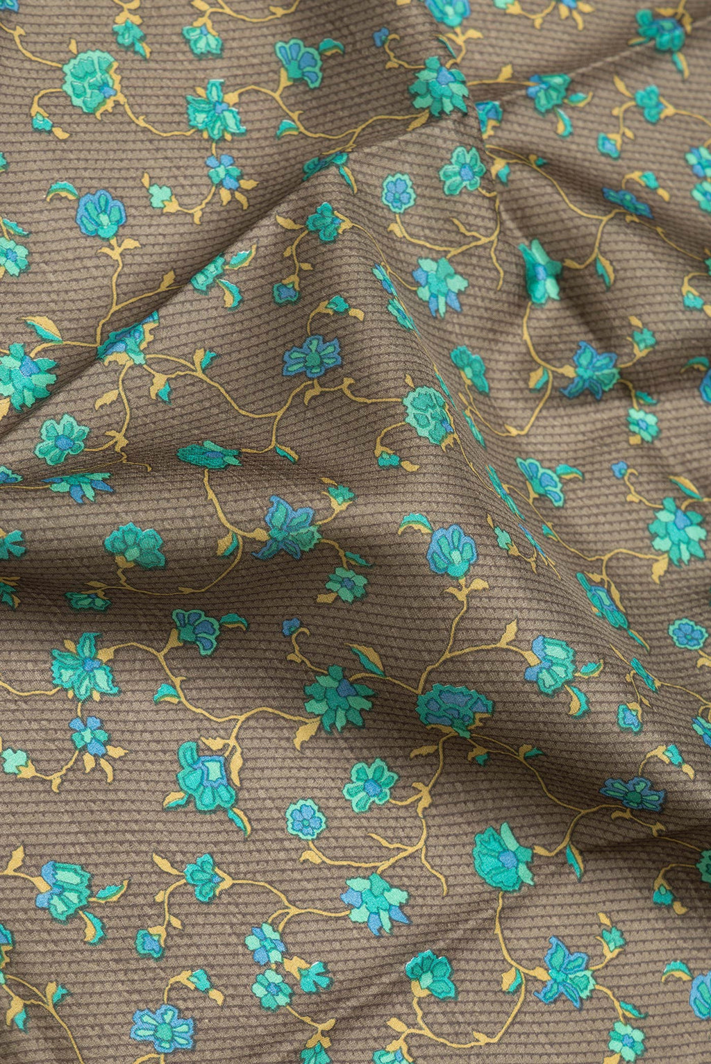 Close up of Mehandi Green Dual Tone Printed Silk Saree with Printed design on the body and Printed Border.  displaying folds
