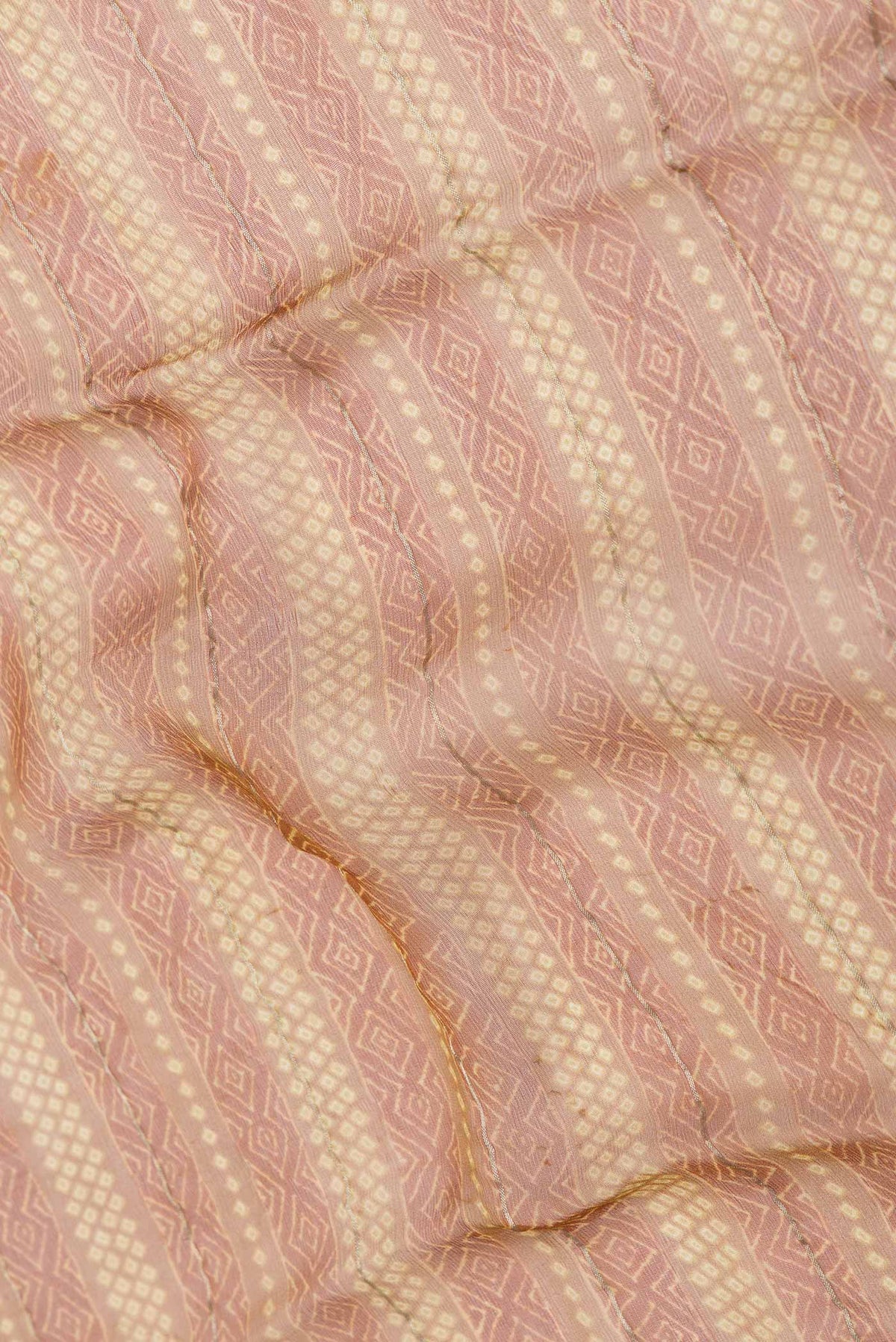 Close up of Mustard Dual Tone Mysore Chiffon Saree with Printed design on the body and Zari Border displaying folds
