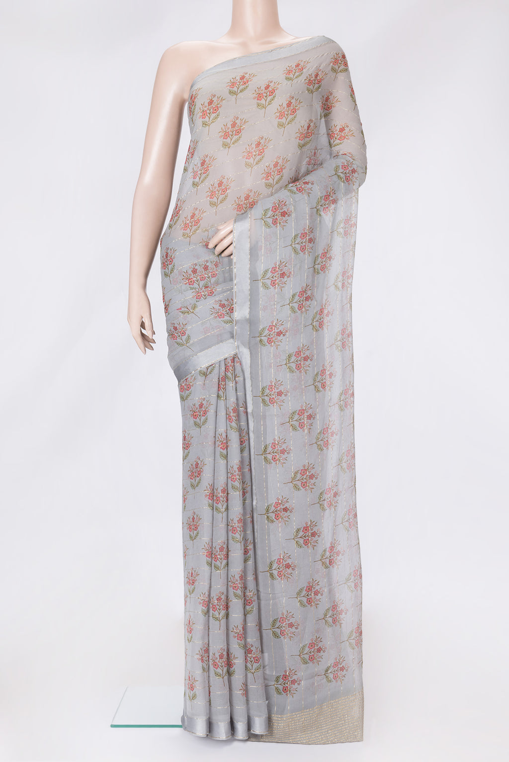 Grey Dual Tone Mysore Georgette Saree with Printed design on the body and Zari Border.  displayed on a mannequin