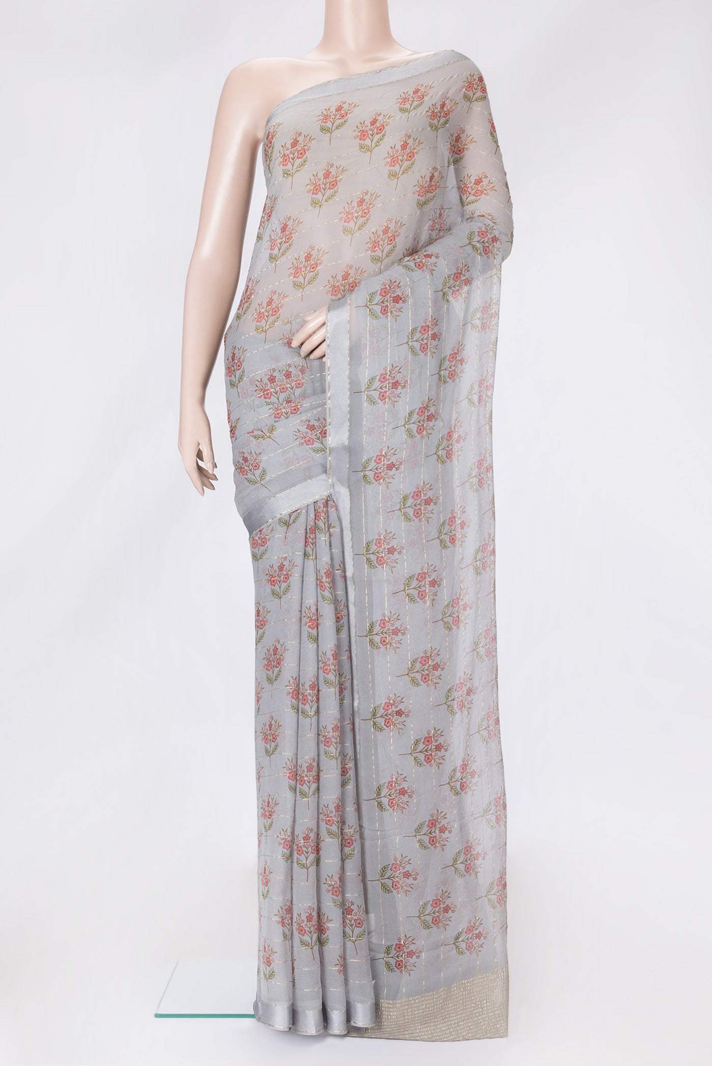 Grey Dual Tone Mysore Georgette Saree with Printed design on the body and Zari Border.  displayed on a mannequin