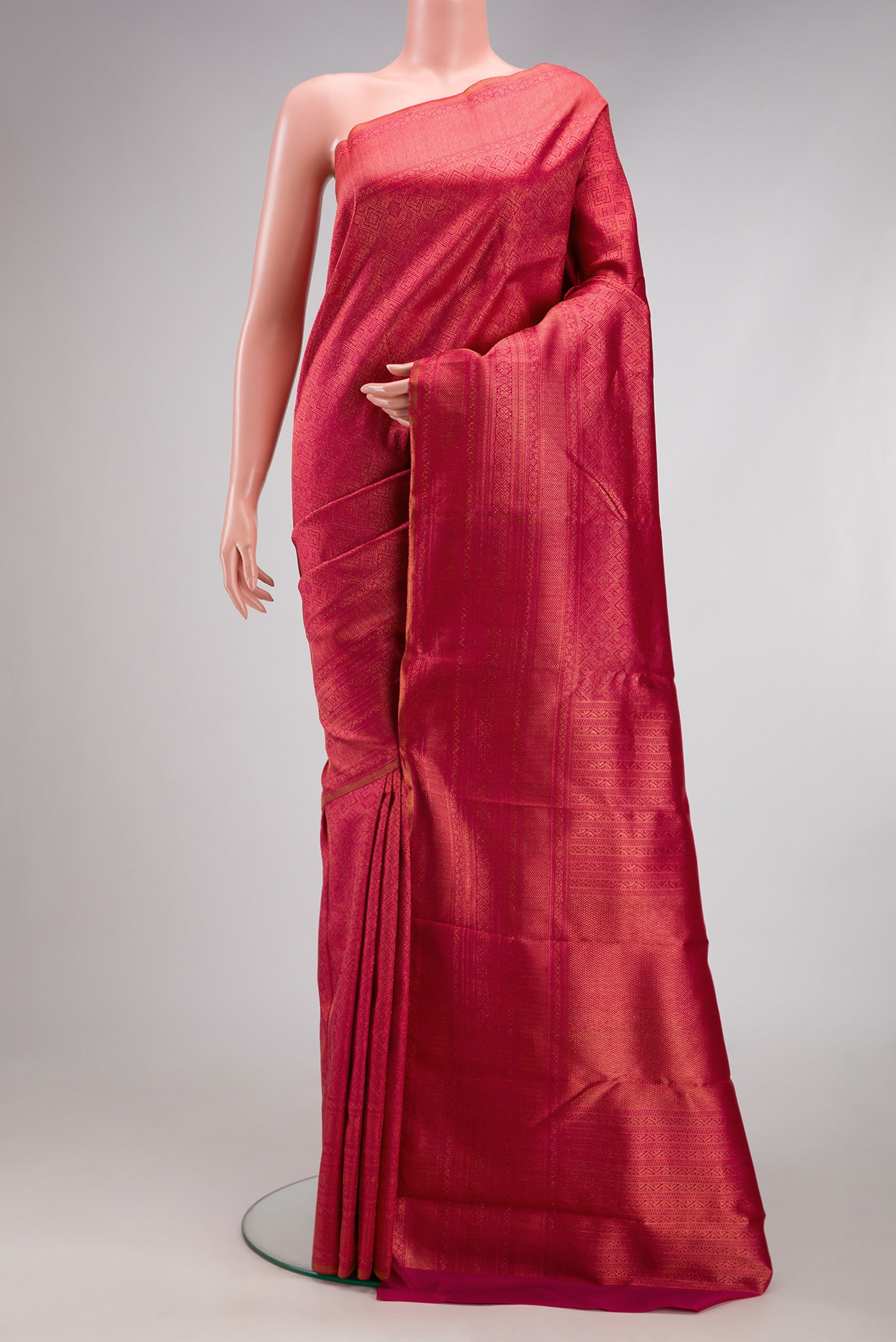 Pink Kanchipuram Silk Saree with Zari Brocade on the body and Fancy Border.  displayed on a mannequin
