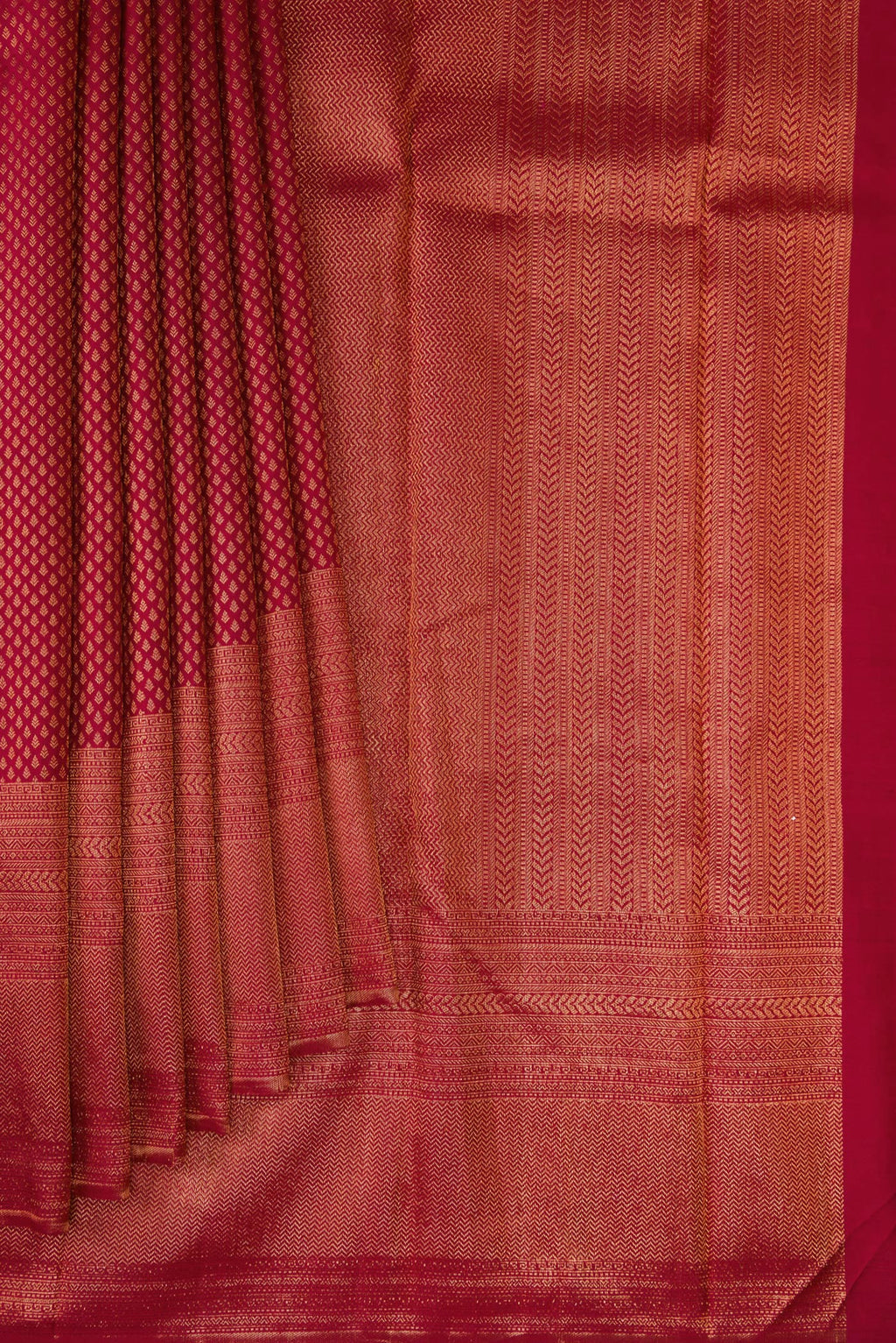 Pleats and pallu of Maroon Kanchipuram Silk Saree with Zari Brocade on the body and Fancy Border. 