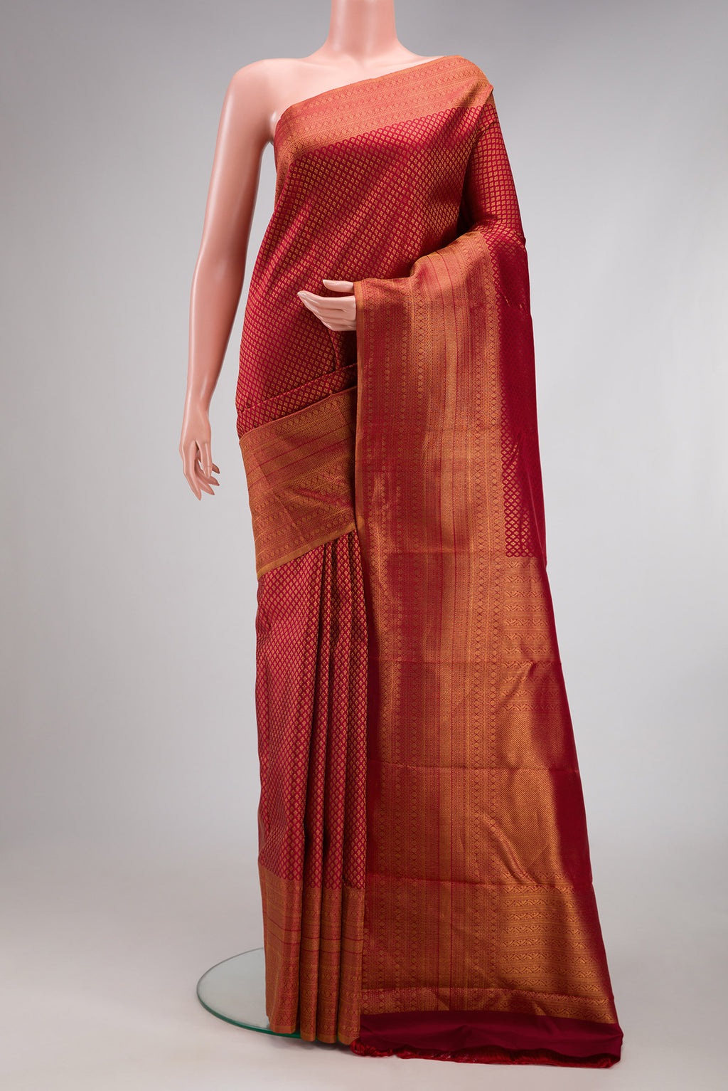 Red Kanchipuram Silk Saree with Zari Brocade on the body and Fancy Border.  displayed on a mannequin