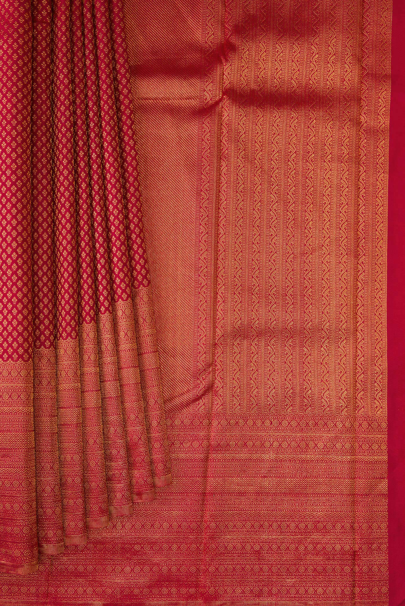 Pleats and pallu of Red Kanchipuram Silk Saree with Zari Brocade on the body and Fancy Border. 