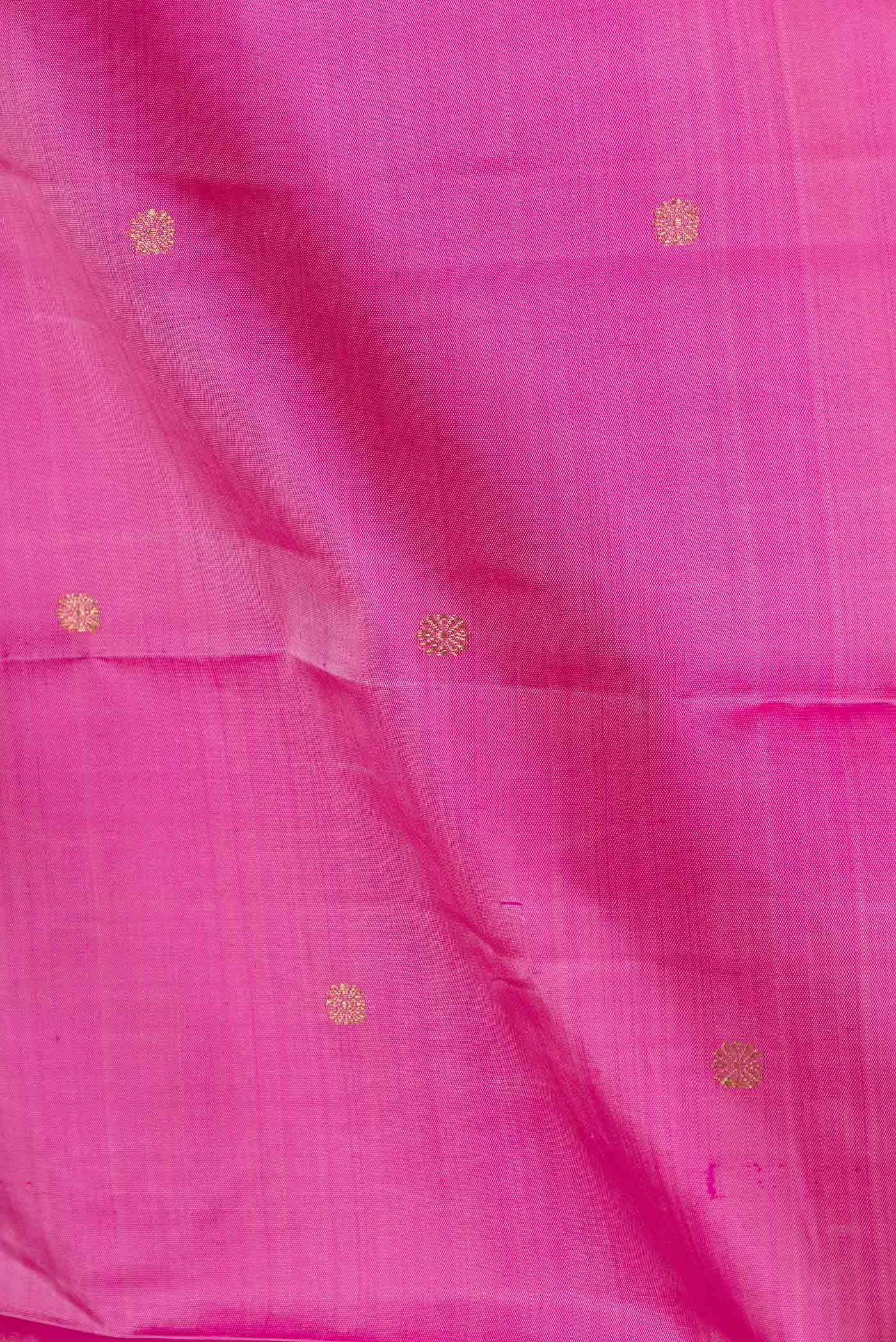 Close up of Pure Silk Pure Zari Pink Dual Tone Kanchipuram Saree with Zari Butta on the body and Zari Border displaying folds