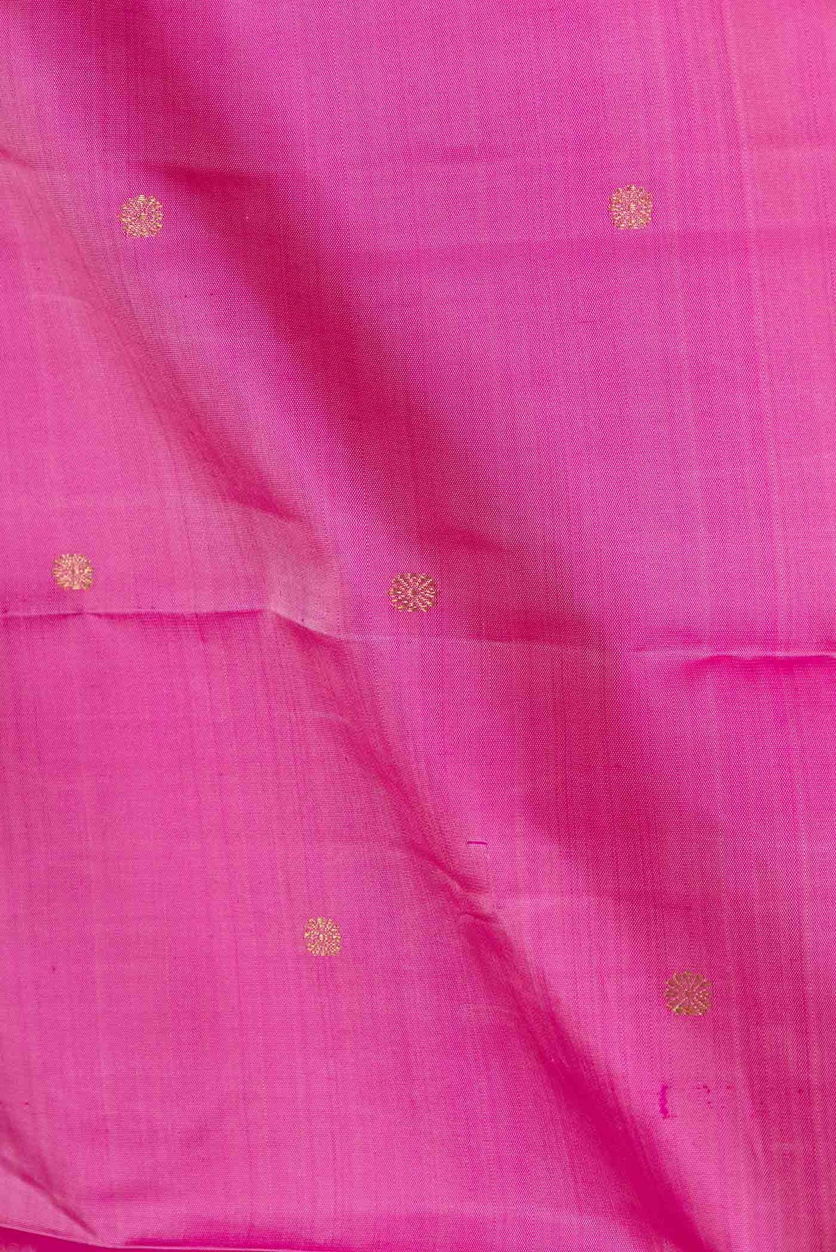 Close up of Pure Silk Pure Zari Pink Dual Tone Kanchipuram Saree with Zari Butta on the body and Zari Border displaying folds
