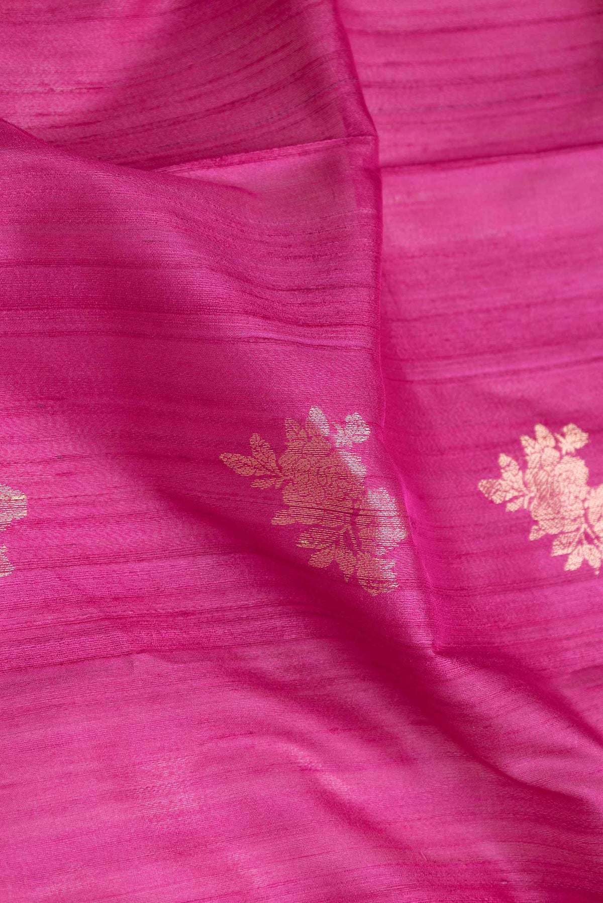 Close up of Pink Dual Tone Banarasi Silk Saree with Zari Butta on the body and Zari Border displaying folds