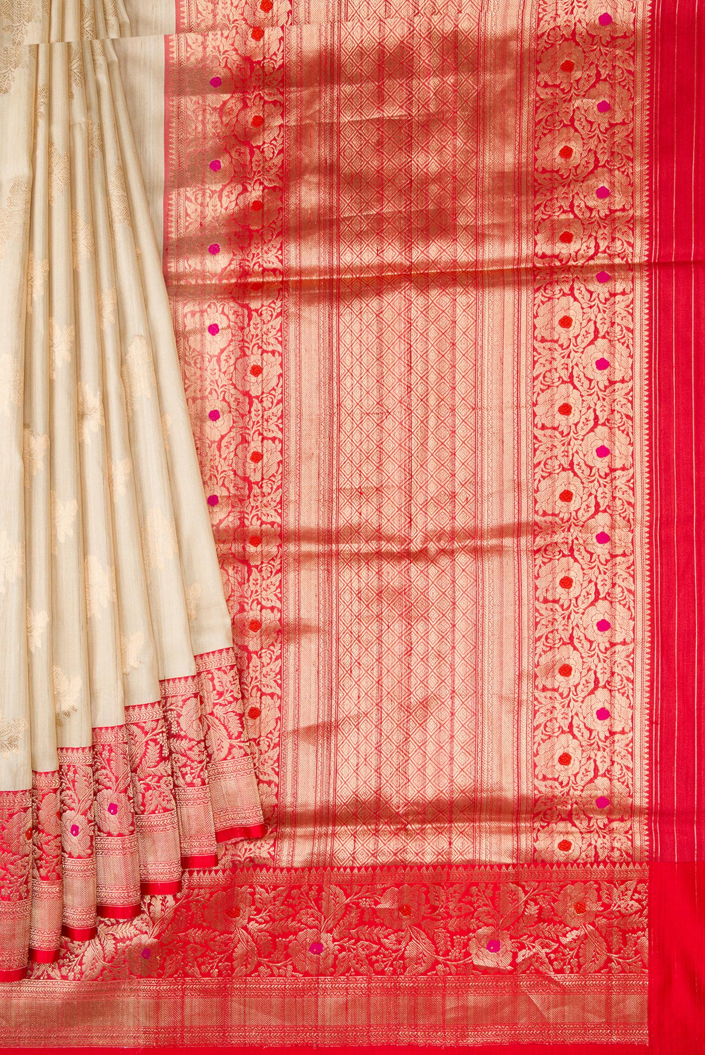 Pleats and pallu of Beige Dual Tone Tussar Silk Saree with Zari Butta on the body and Zari And Thread Border. 
