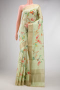 Pista Green Dual Tone Tussar Silk Saree with Printed design on the body and Zari Border.  displayed on a mannequin