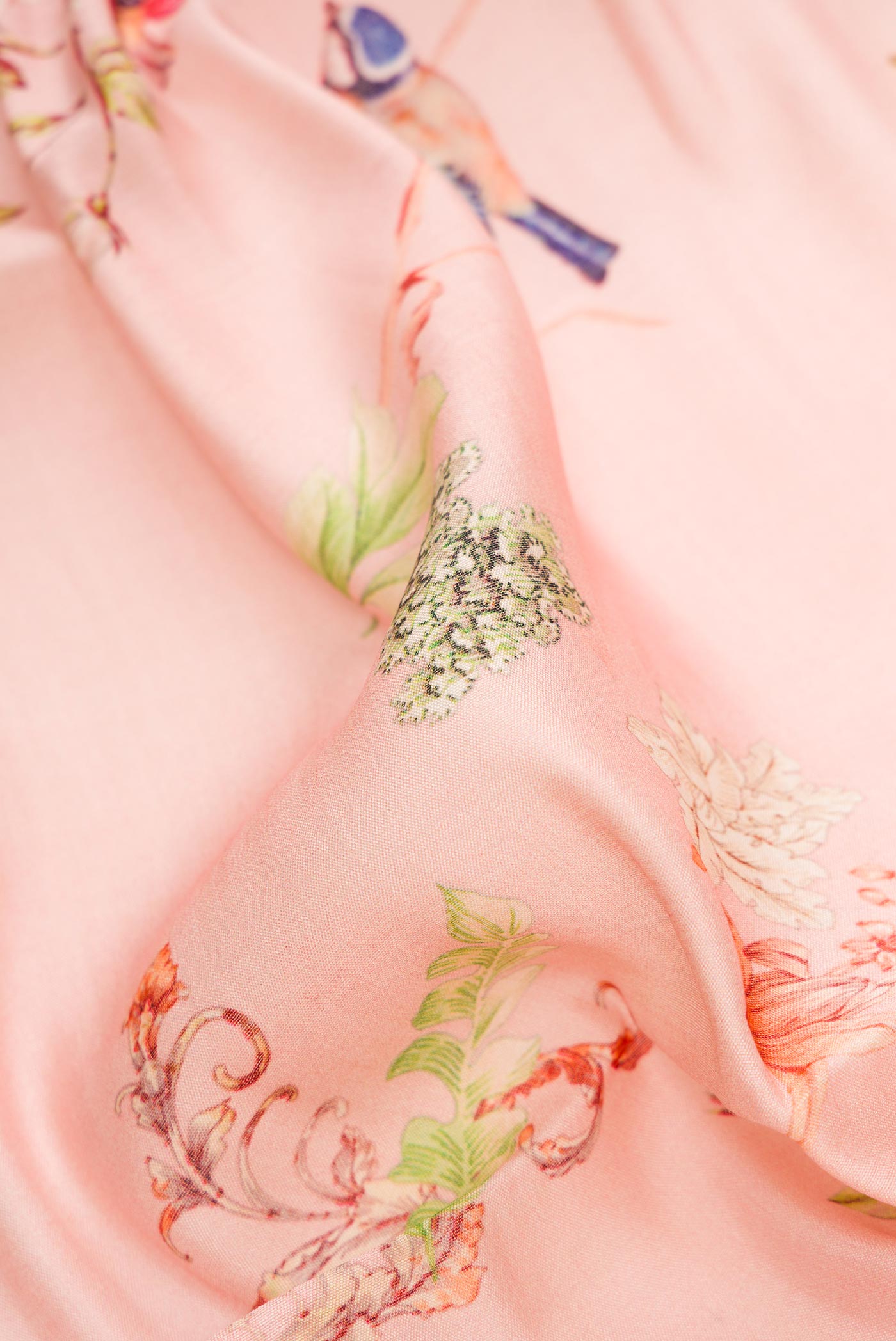 Close up of Pink Dual Tone Tussar Silk Saree with Printed design on the body and Zari Border.  displaying folds