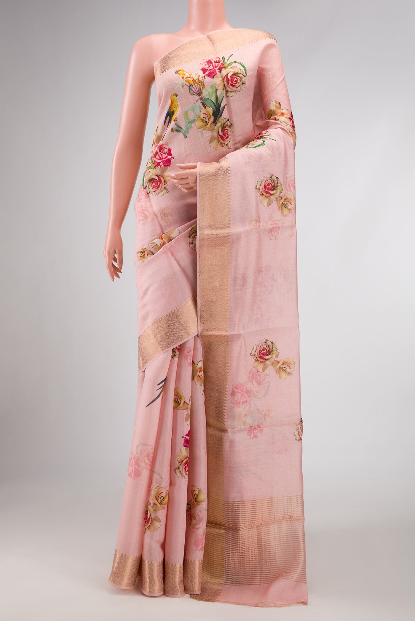 Pink Dual Tone Tussar Silk Saree with Printed design on the body and Zari Border.  displayed on a mannequin