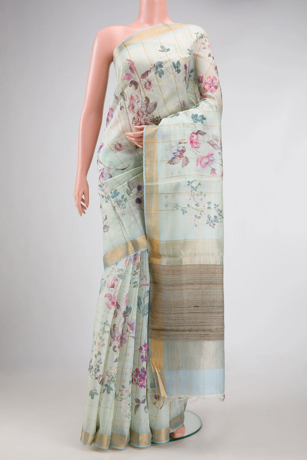 Pista Green Dual Tone Tussar Silk Saree with Checked design on the body and Zari Border.  displayed on a mannequin