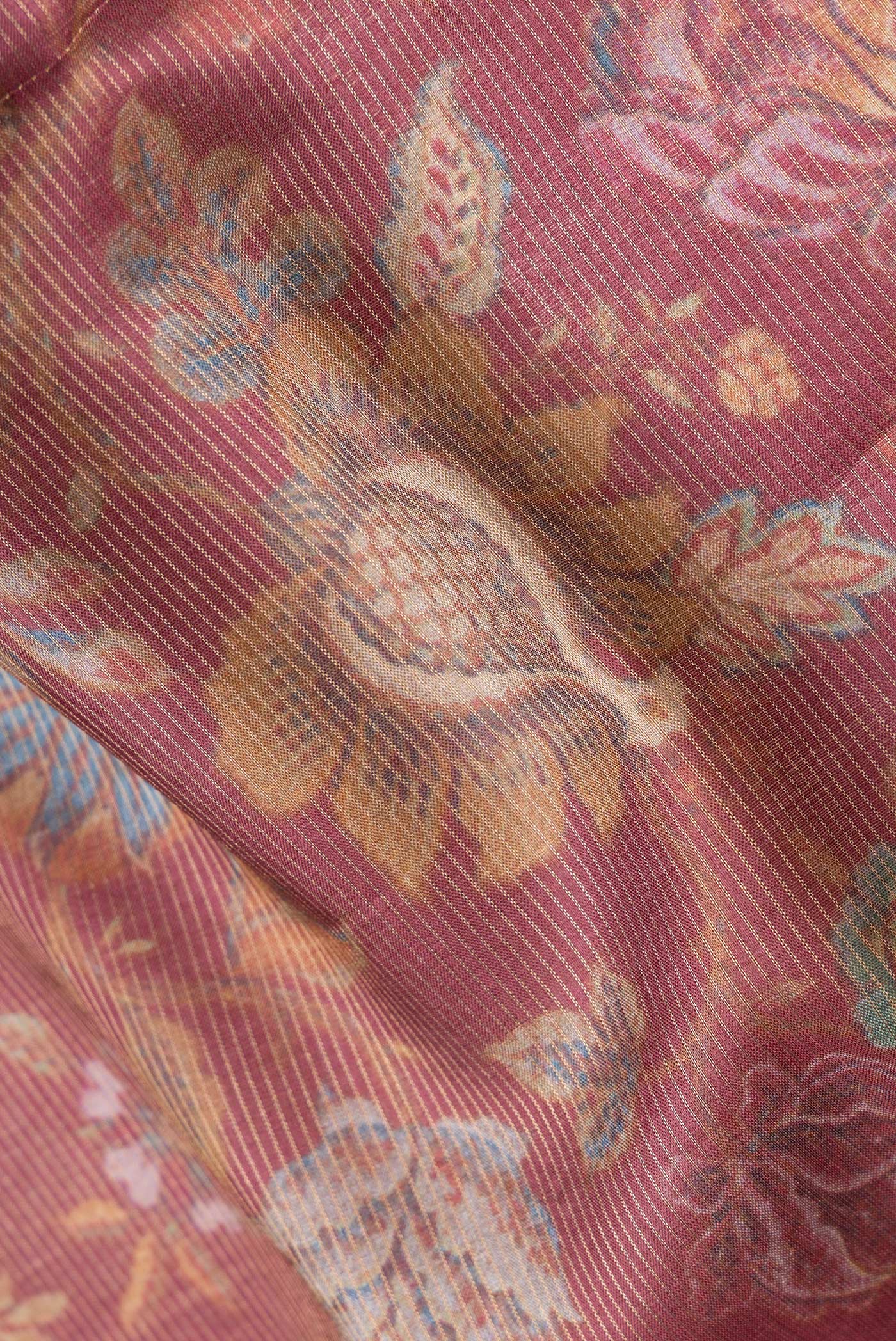 Close up of Peach Dual Tone Tussar Silk Saree with Printed design on the body and Zari Border.  displaying folds