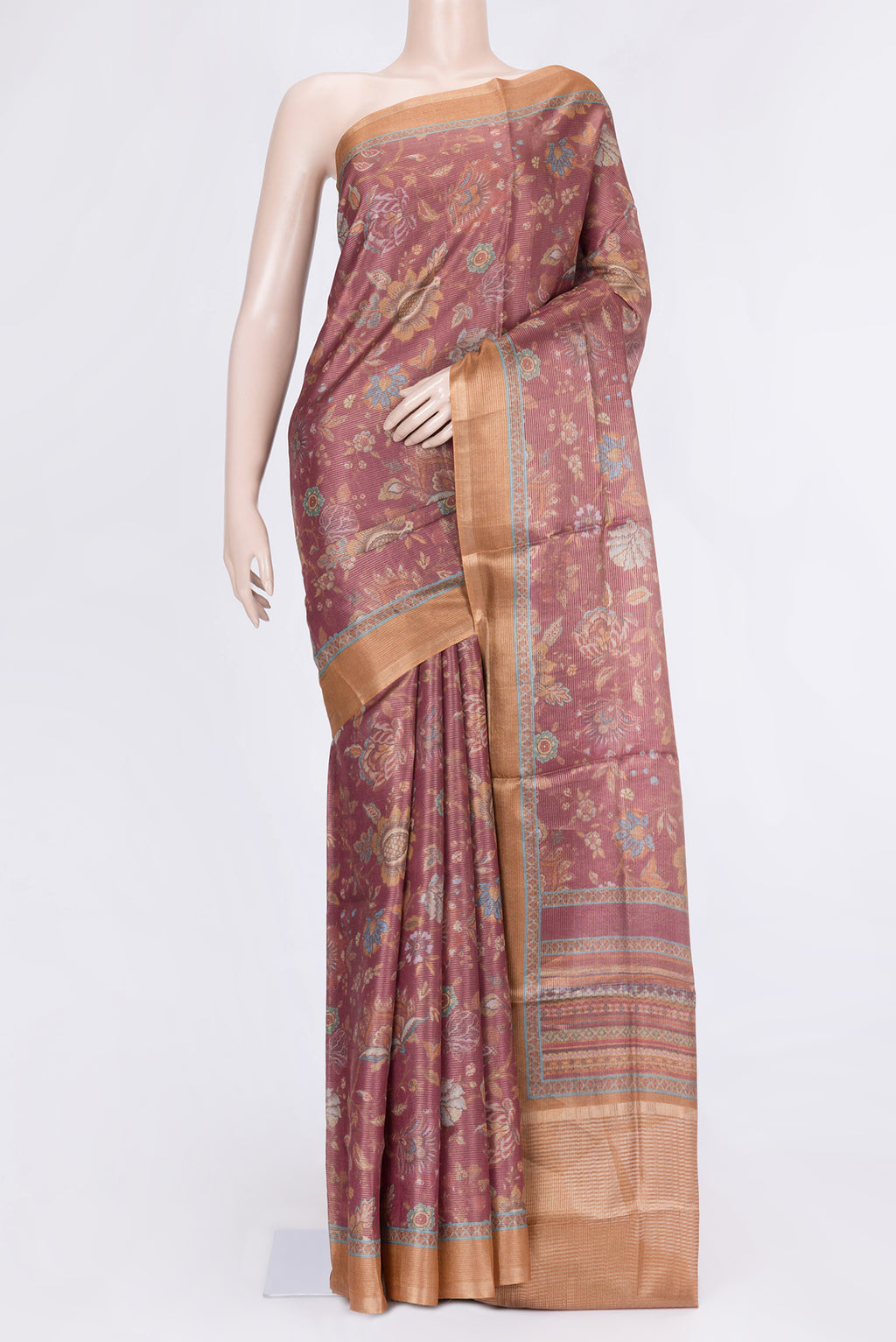 Peach Dual Tone Tussar Silk Saree with Printed design on the body and Zari Border.  displayed on a mannequin