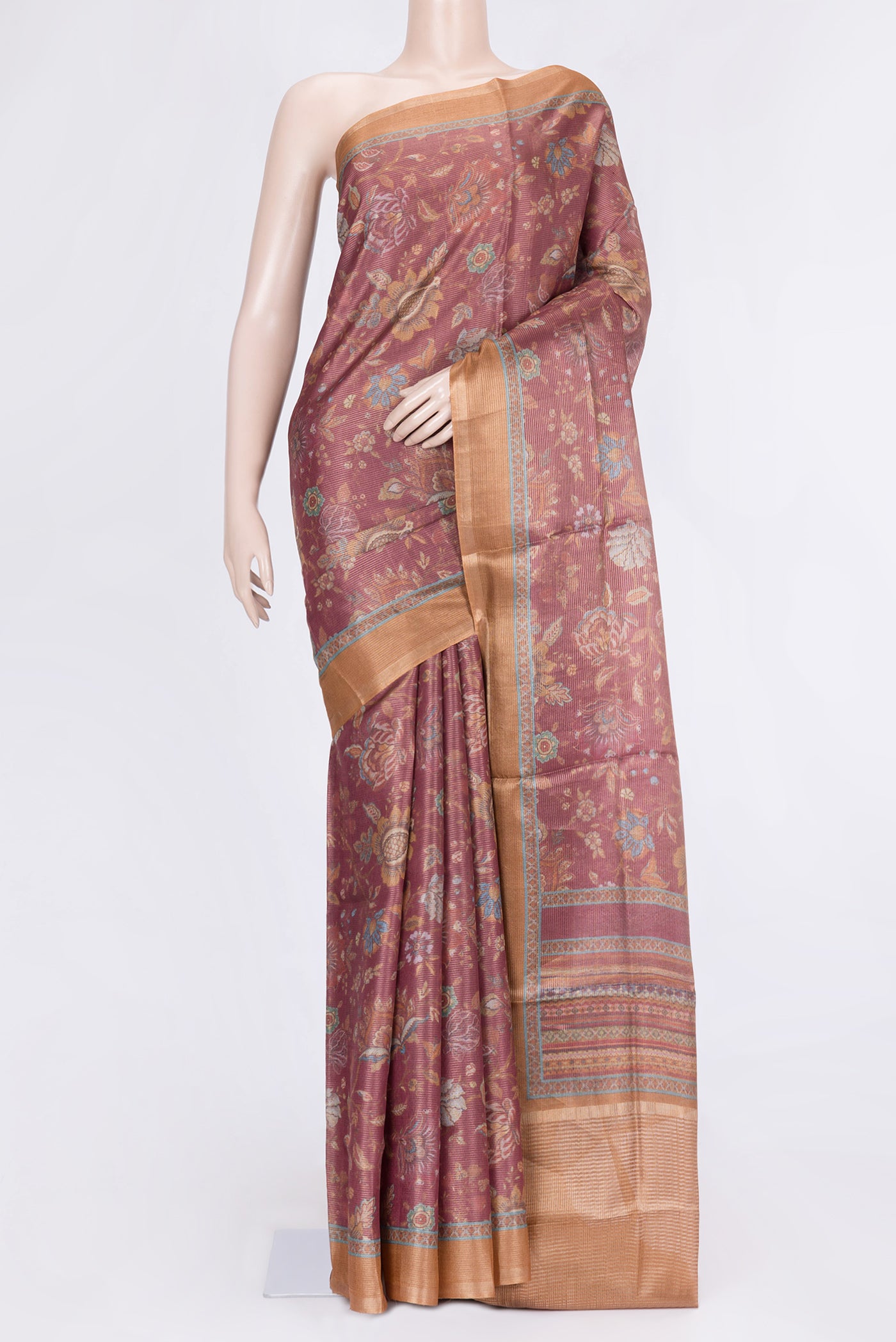 Peach Dual Tone Tussar Silk Saree with Printed design on the body and Zari Border.  displayed on a mannequin