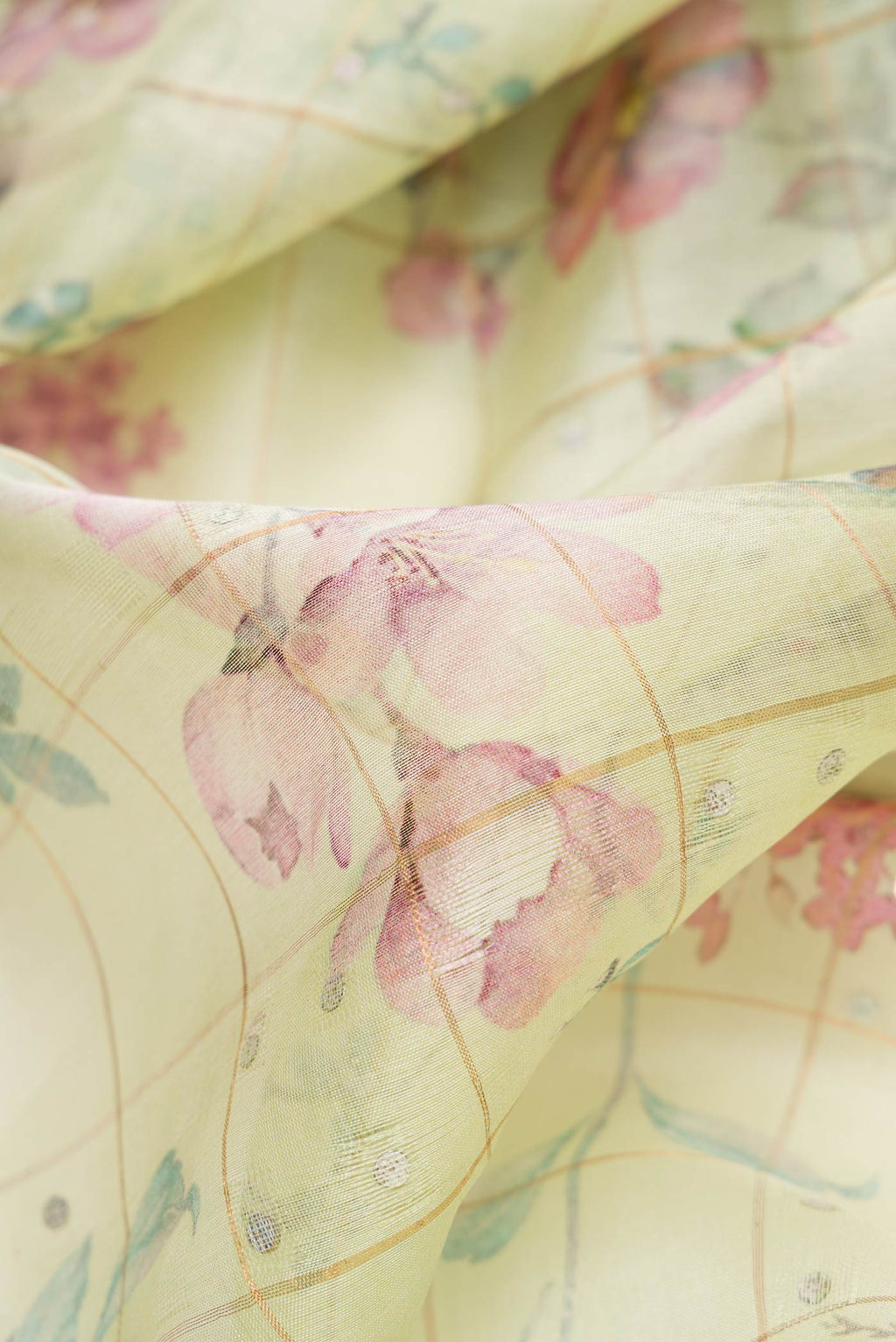 Close up of Pista Green Dual Tone Tussar Silk Saree with Zari Butta on the body and Zari Border.  displaying folds