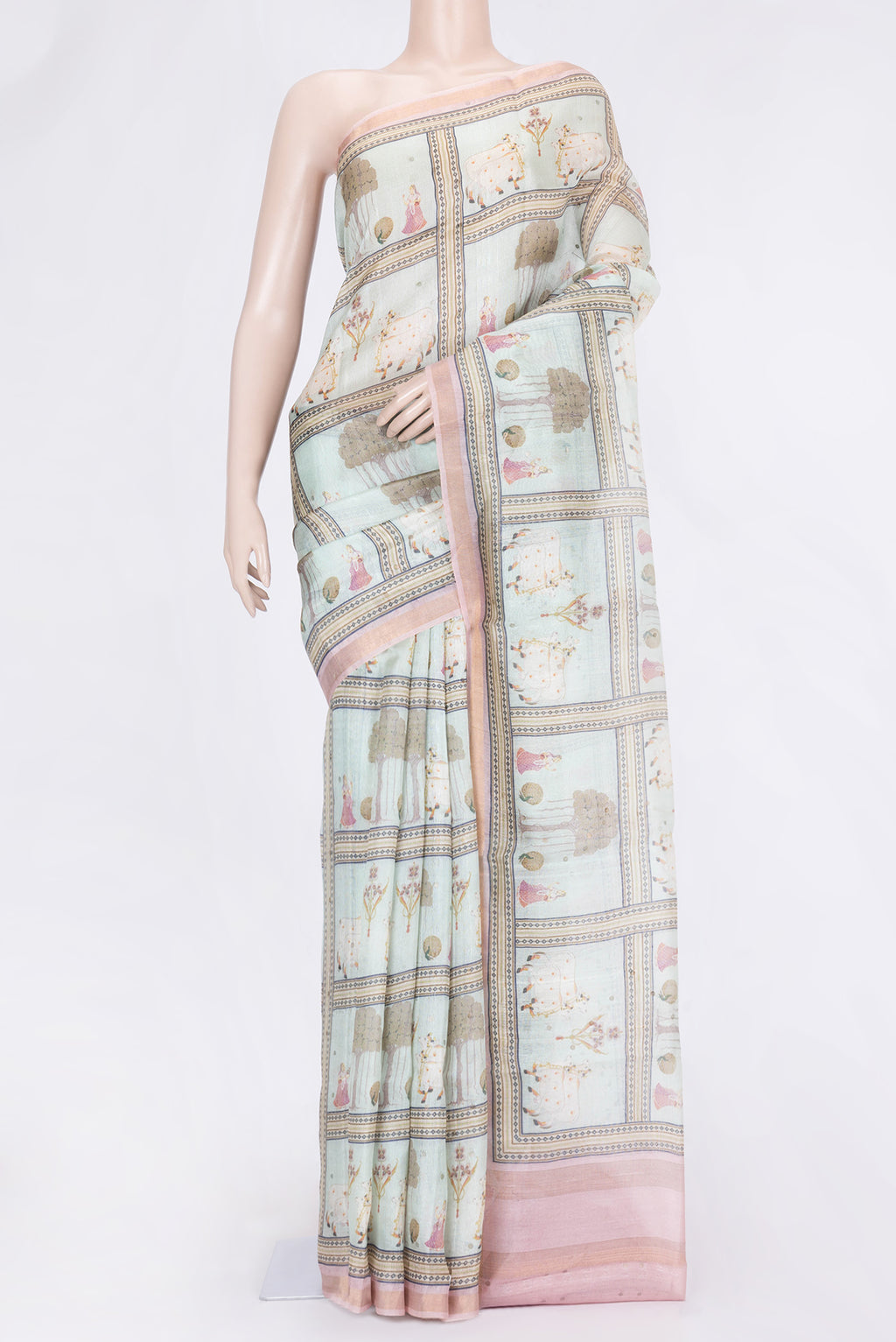 Pista Green Dual Tone Tussar Silk Saree with Printed design on the body and Zari Border.  displayed on a mannequin